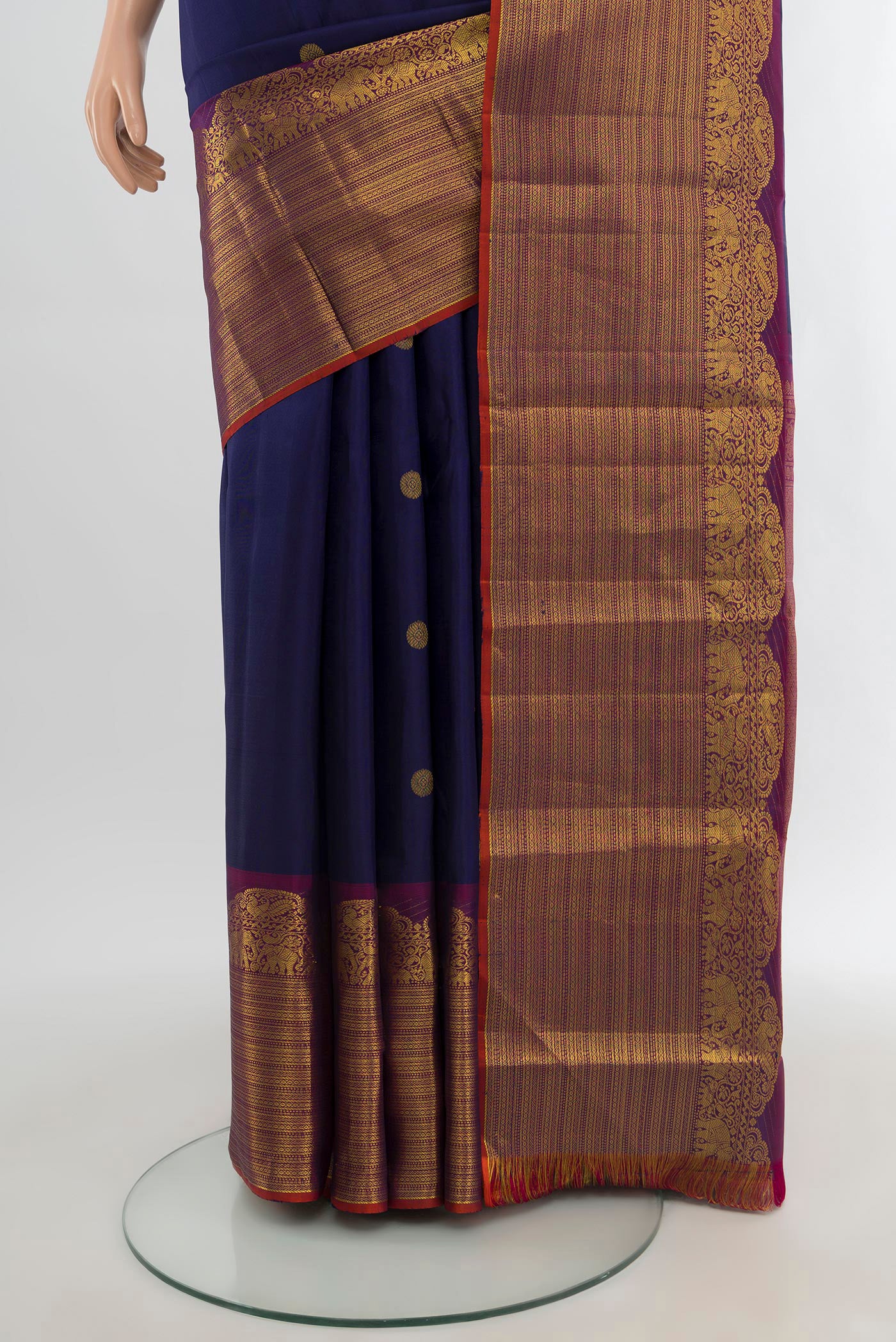 Pleats and pallu of Navy Blue Kanchipuram Silk Saree with Zari Butta on the body and Fancy Border. 