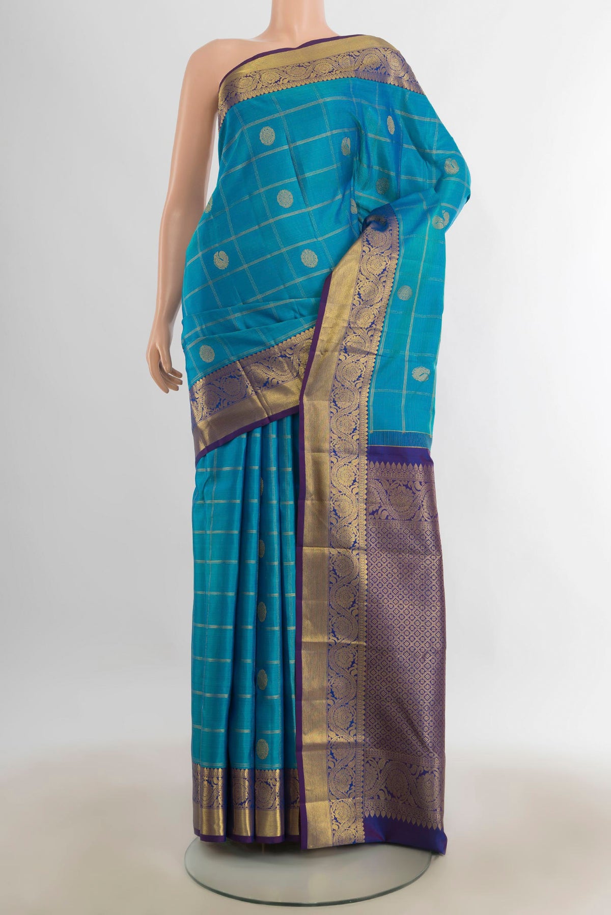 Pure Silk Dark Blue Kanchipuram Saree with Zari Butta on the body and Silk Border.  displayed on a mannequin