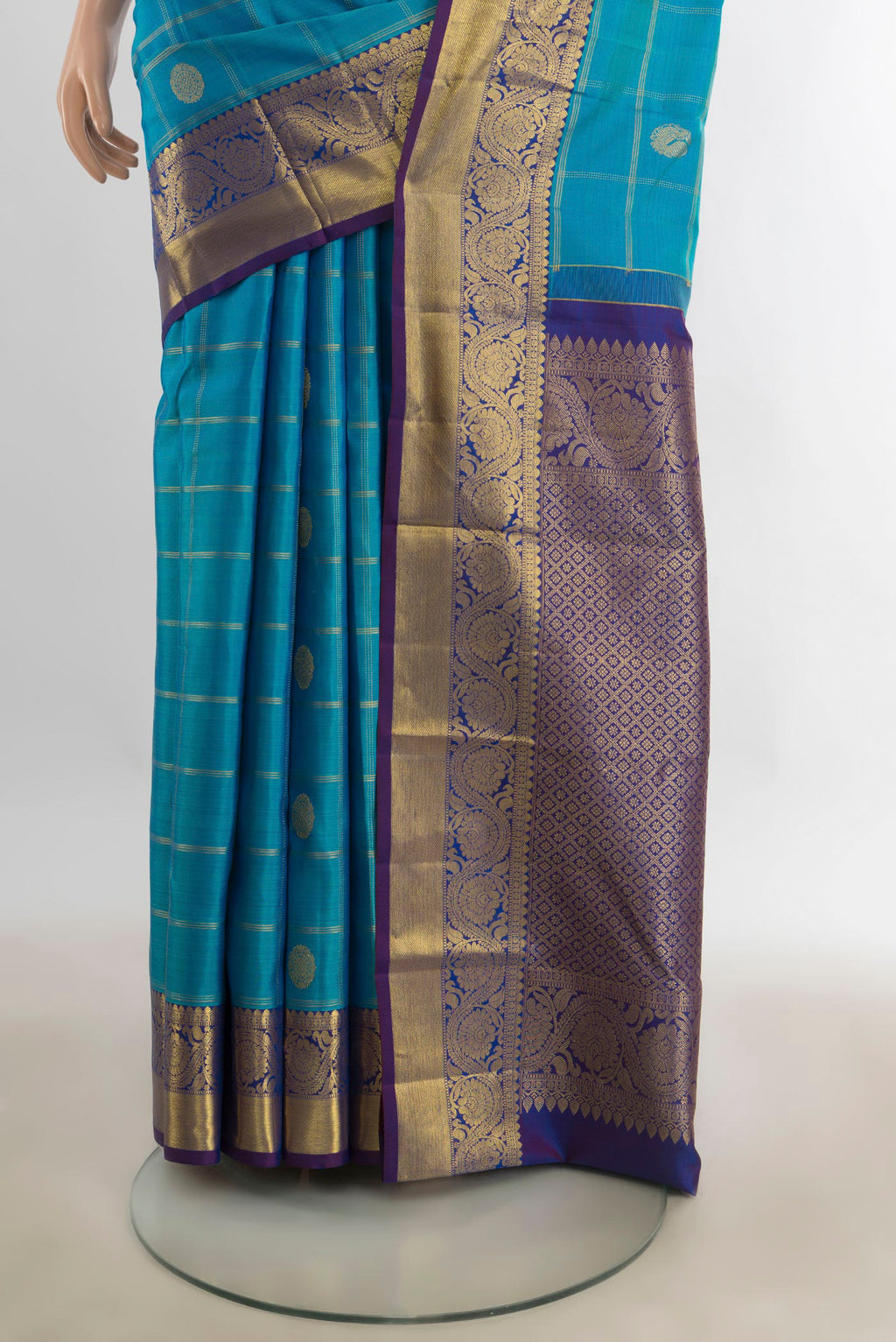 Pleats and pallu of Pure Silk Dark Blue Kanchipuram Saree with Zari Butta on the body and Silk Border. 