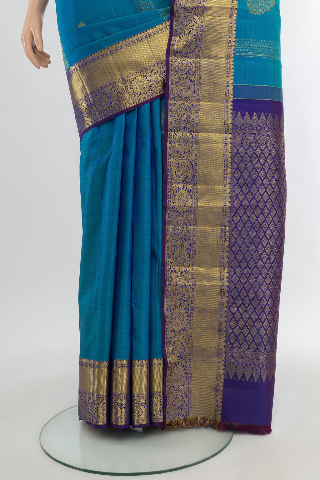 Pleats and pallu of Blue Kanchipuram Silk Saree with Zari Butta on the body and Zari Border. 