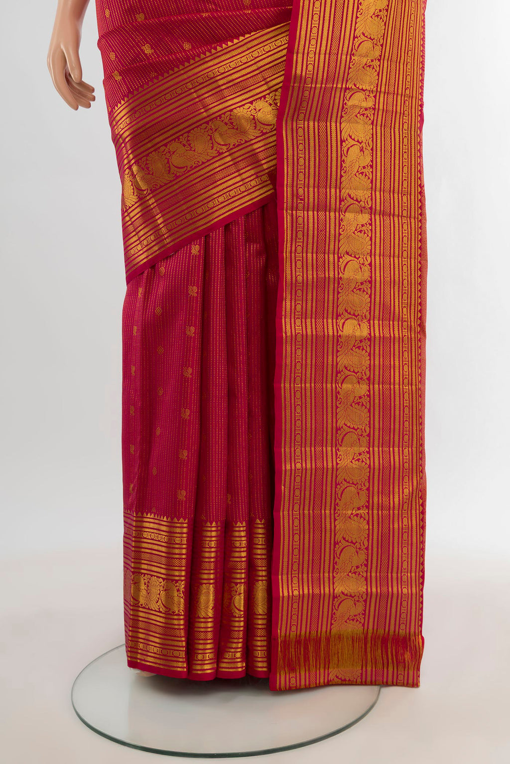 Pleats and pallu of Dark Pink Kanjivaram Silk Saree with Zari Butta on the body and Zari Border. 