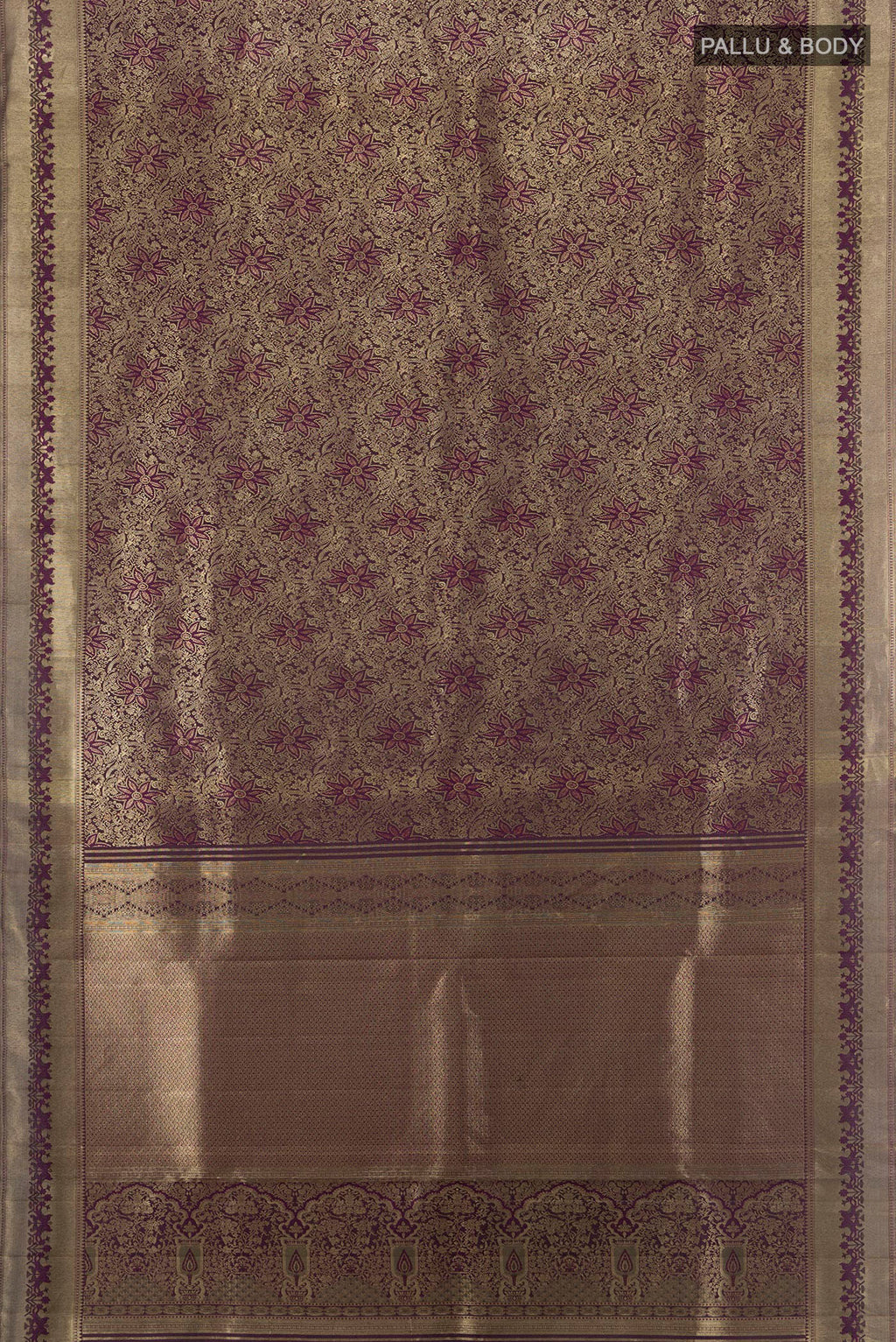 Flat view of Purple Kanjivaram Silk Saree with Zari Brocade on the body and Zari Border. 