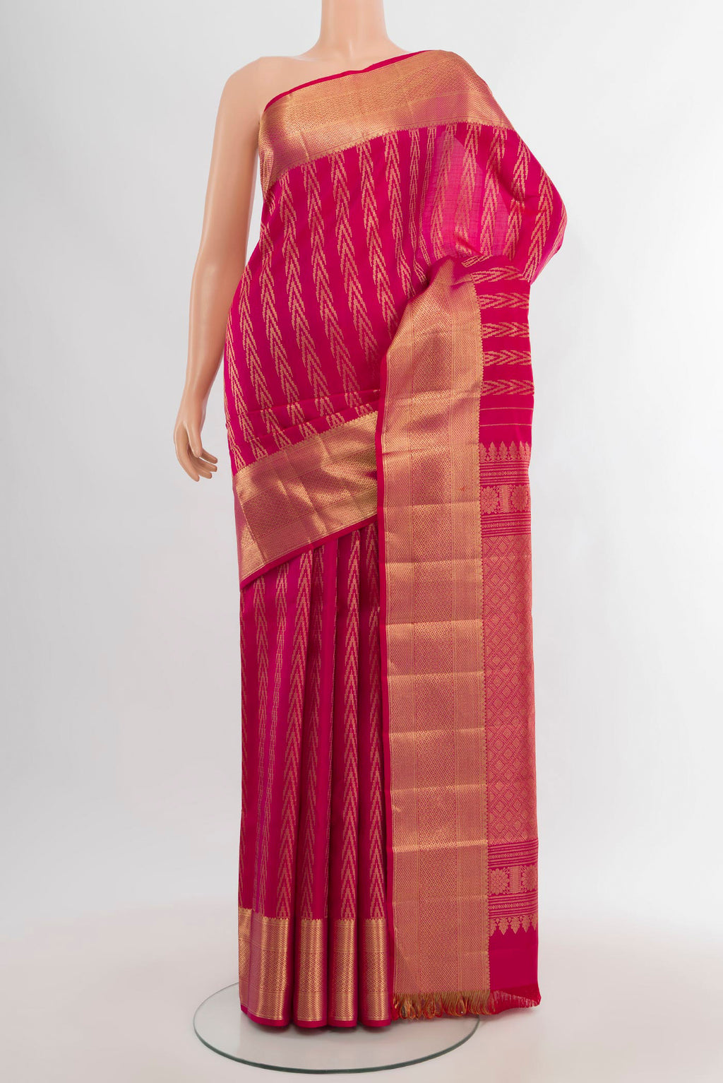 Pink Kanjivaram Silk Saree with Zari Butta on the body and Zari Border.  displayed on a mannequin