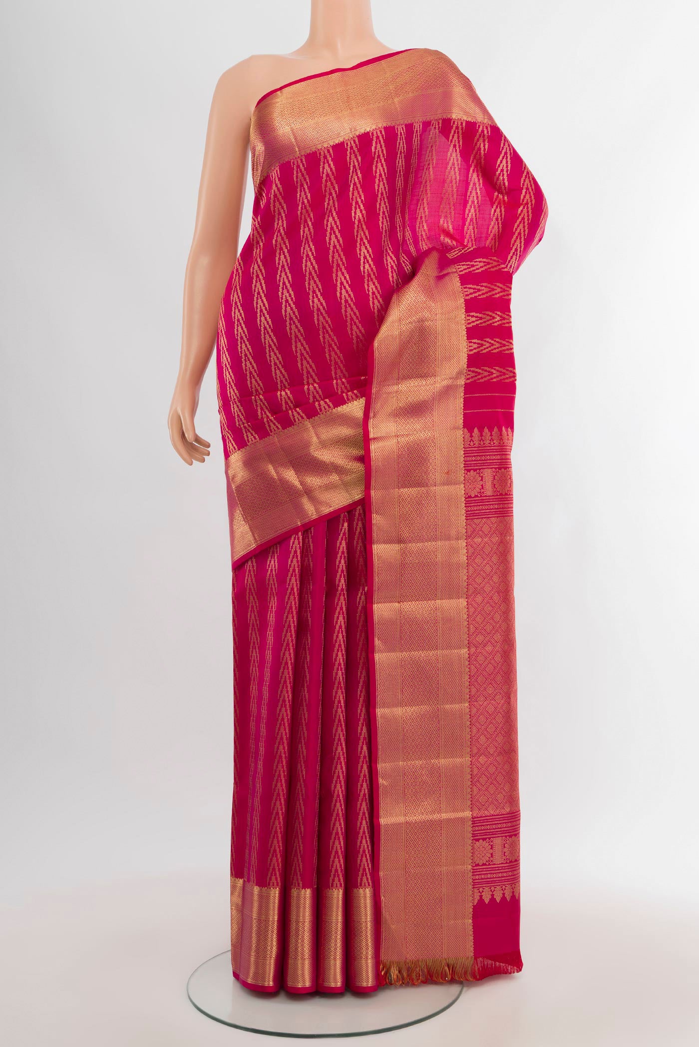 Pink Kanjivaram Silk Saree with Zari Butta on the body and Zari Border.  displayed on a mannequin