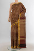 Pure Silk Coffee Brown Kanjivaram Saree with Zari Butta on the body and Silk Border.  displayed on a mannequin