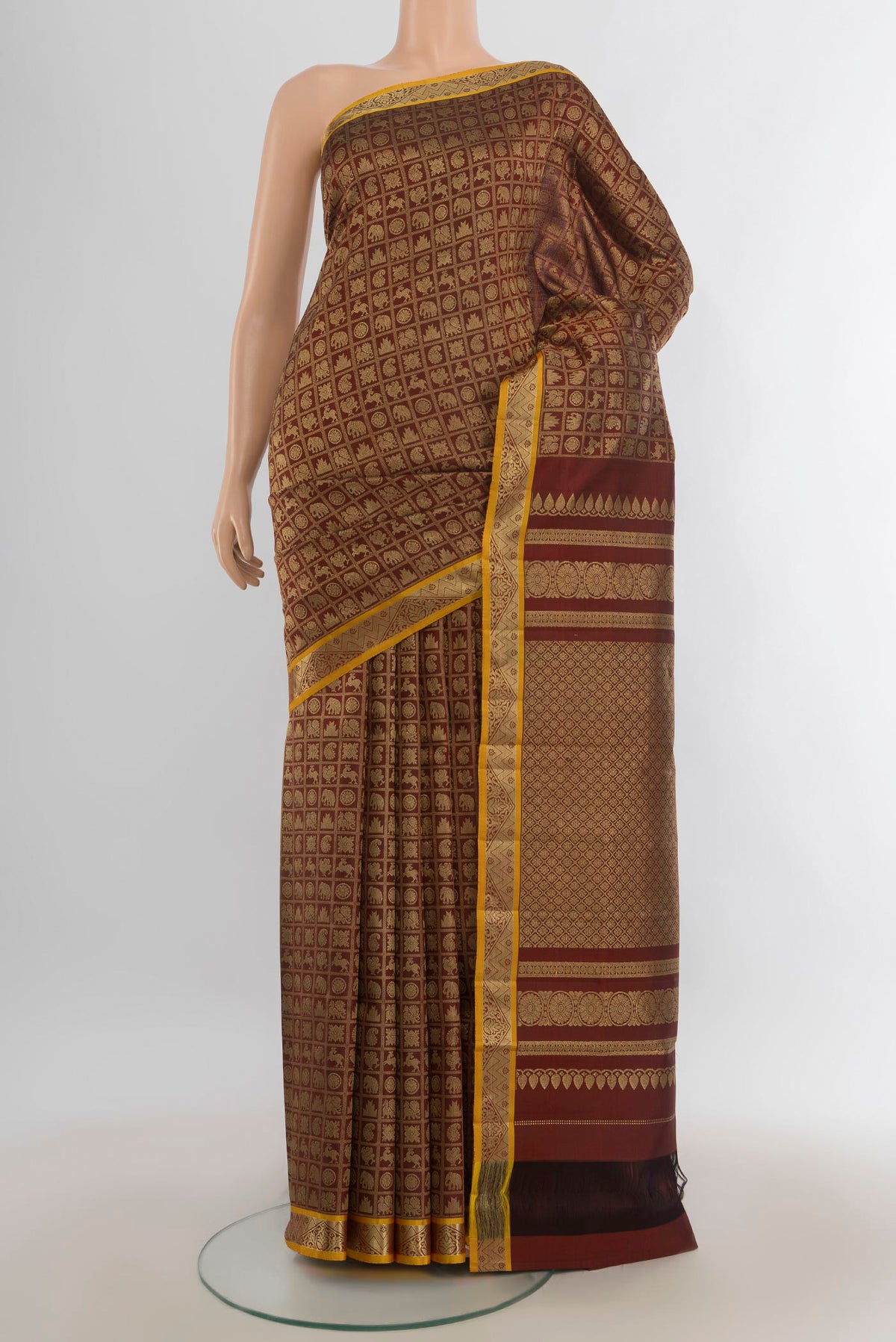 Pure Silk Coffee Brown Kanjivaram Saree with Zari Butta on the body and Silk Border.  displayed on a mannequin
