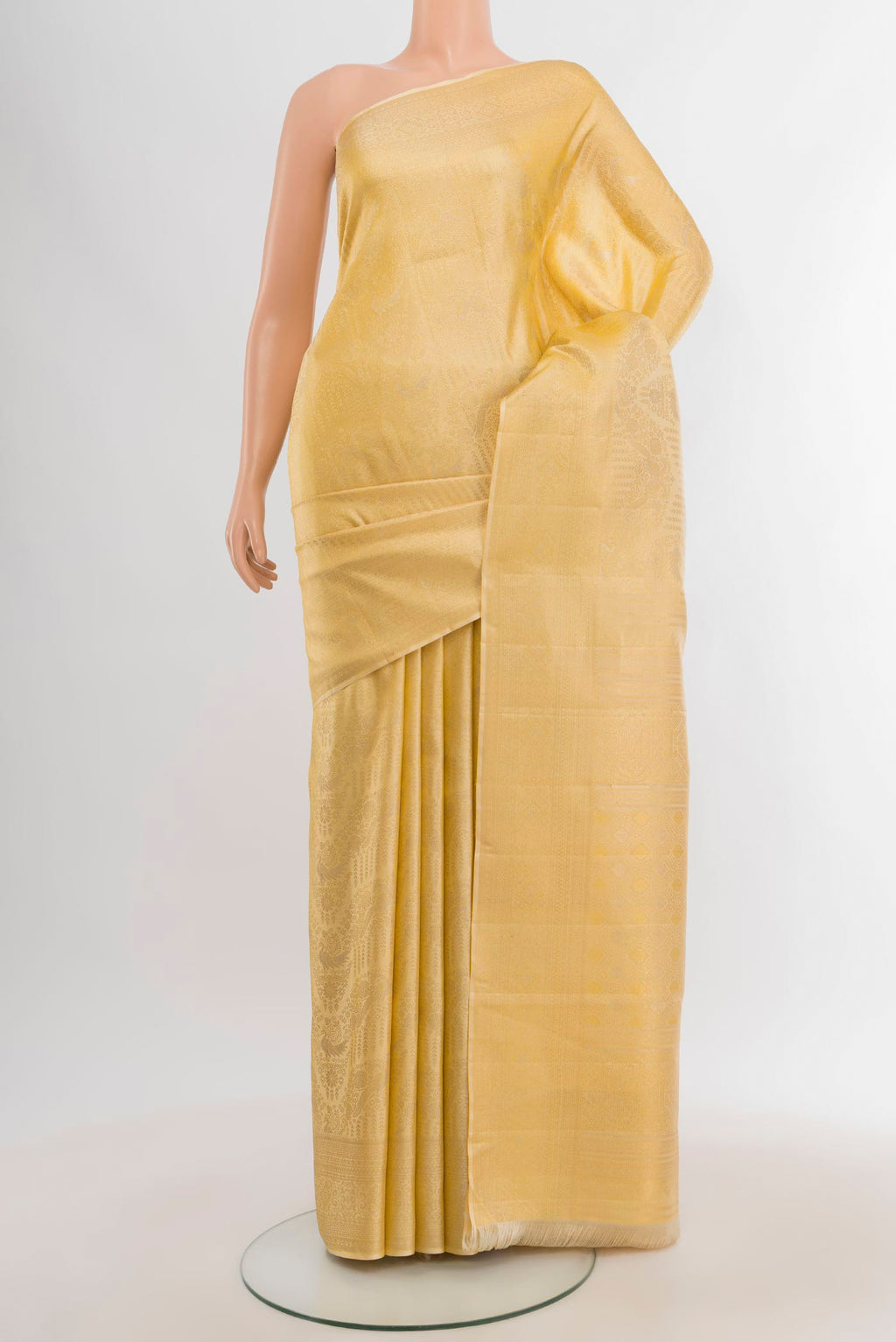 Sandal Kanjivaram Silk Saree with Zari Brocade on the body and Zari Border.  displayed on a mannequin
