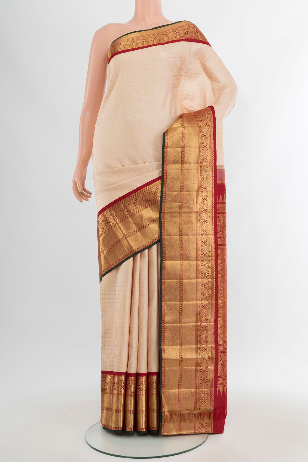Cream Kanchipuram Silk Saree with Checked design on the body and Zari Border.  displayed on a mannequin