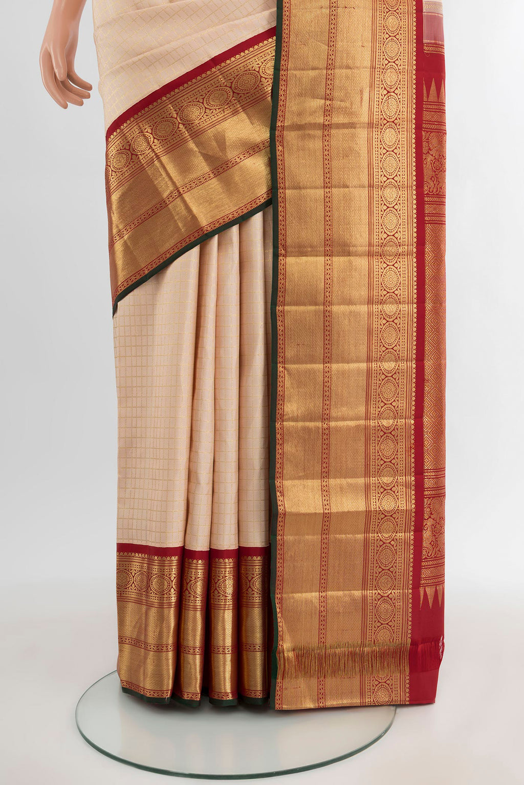 Pleats and pallu of Cream Kanchipuram Silk Saree with Checked design on the body and Zari Border. 
