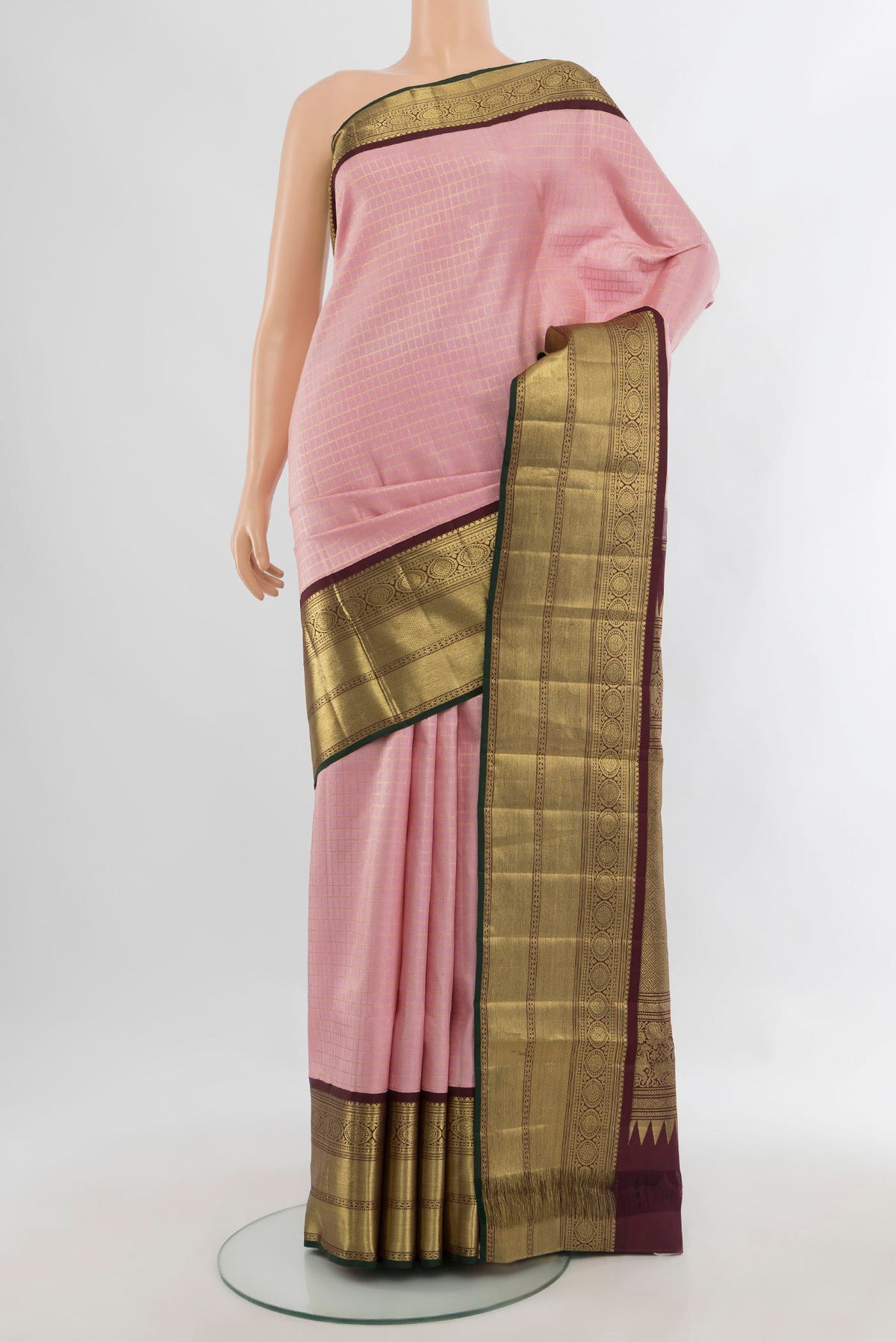 Pure Silk Rose pink Kanchipuram Saree with Checked design on the body and Zari Border.  displayed on a mannequin