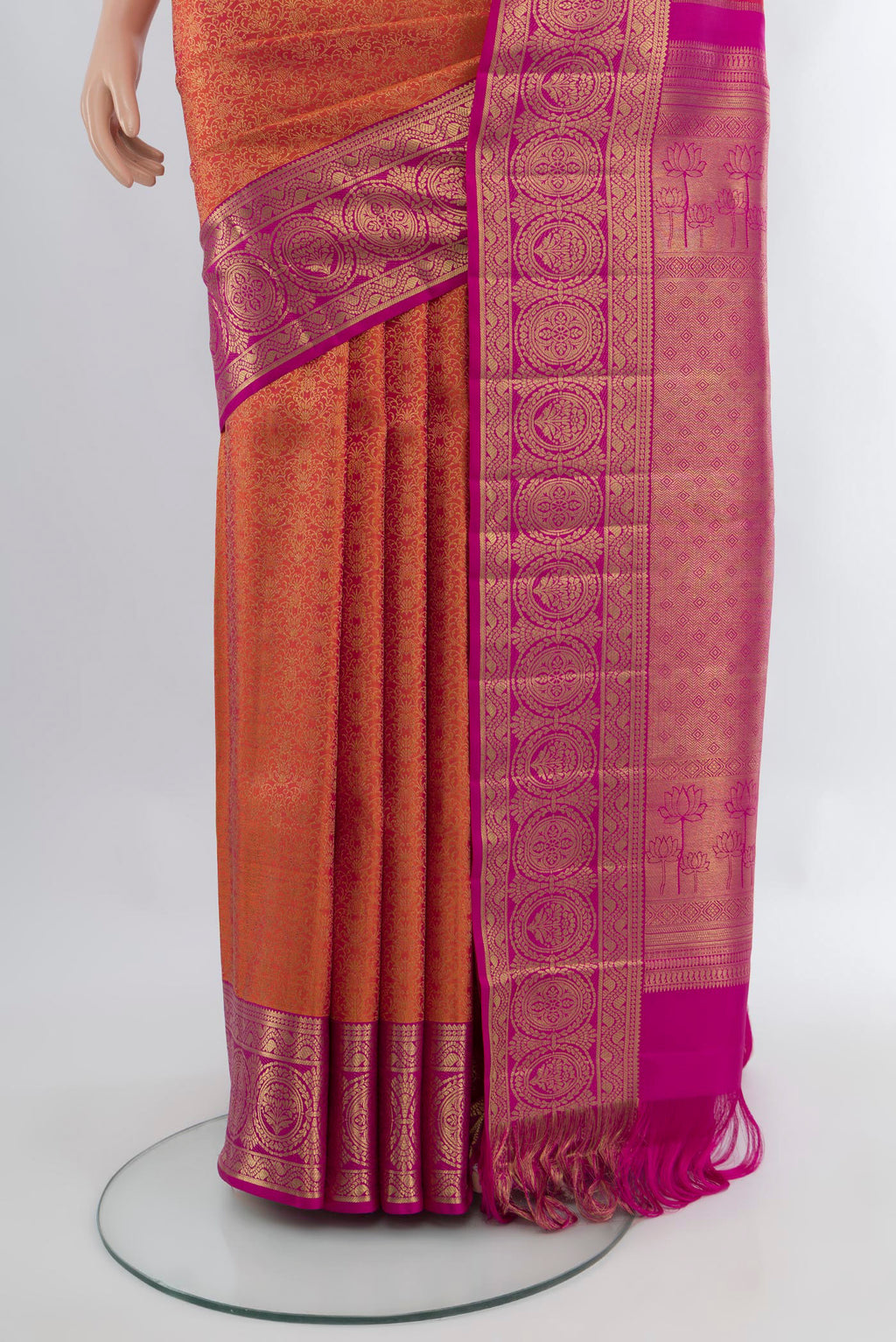 Pleats and pallu of Brick Orange Kanchipuram Silk Saree with Zari Brocade on the body and Zari Border. 