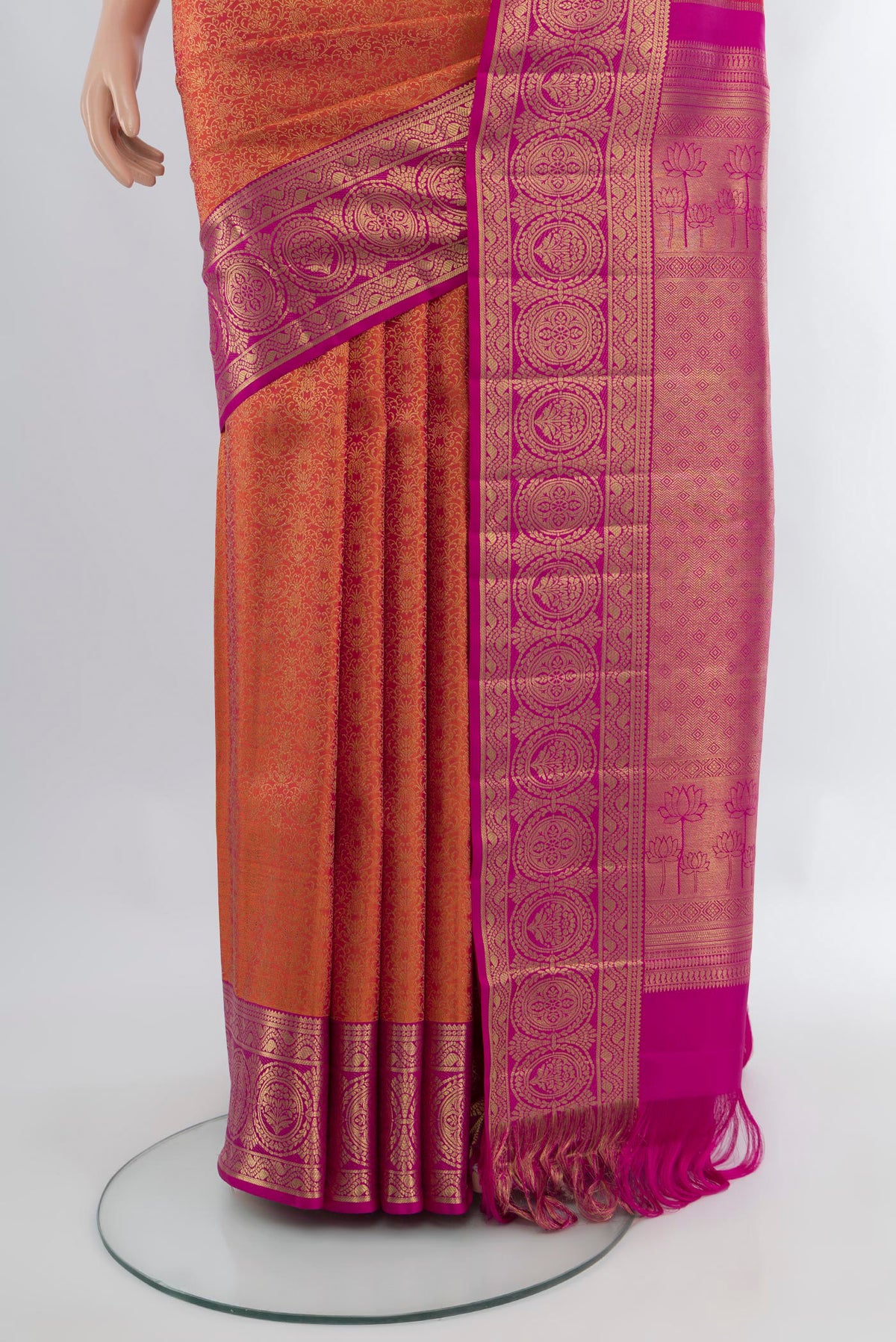 Pleats and pallu of Brick Orange Kanchipuram Silk Saree with Zari Brocade on the body and Zari Border. 