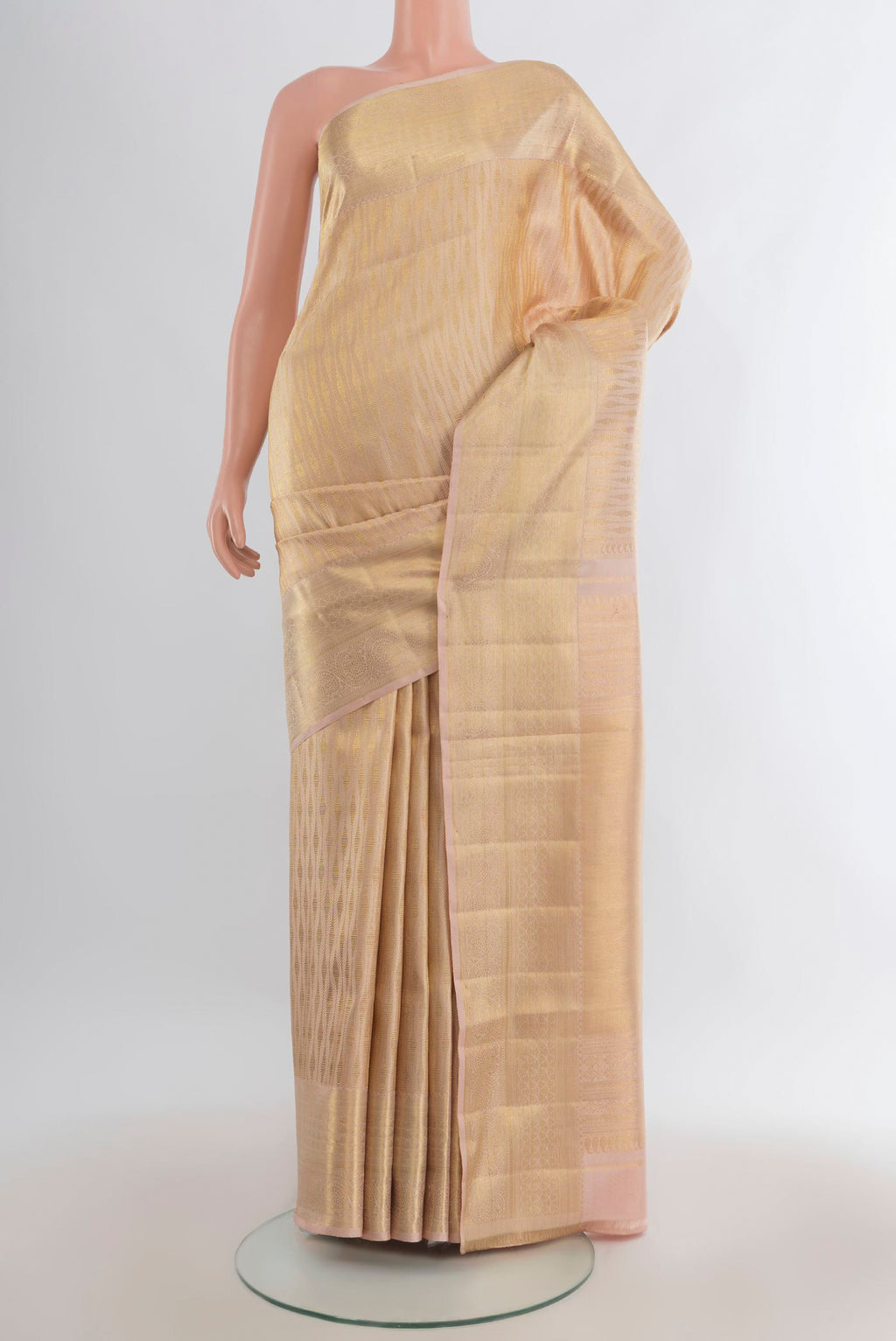 Pure Silk Sandal Kanchipuram Saree with Zari Brocade on the body and Zari Border.  displayed on a mannequin