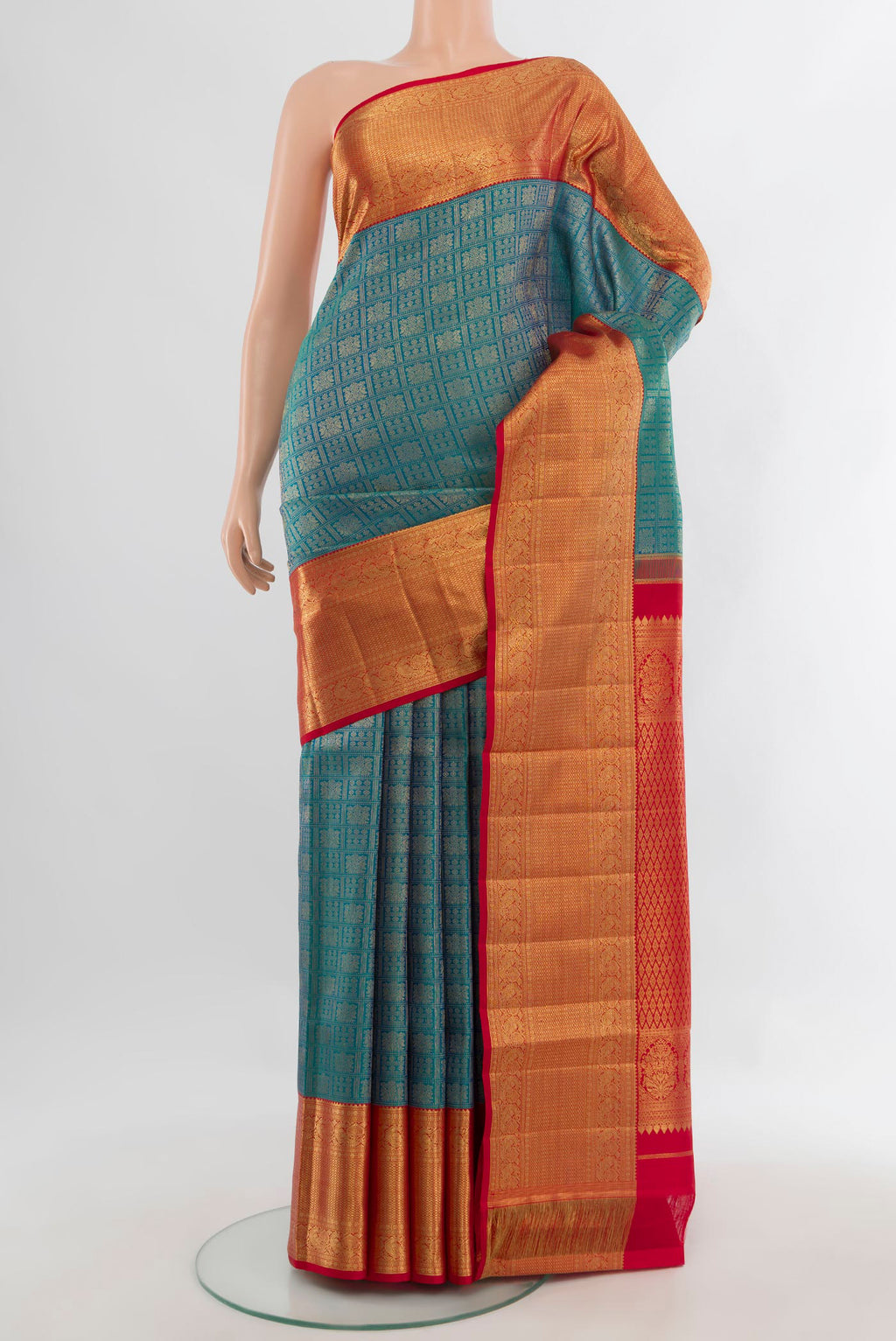 Pure Silk Peacock Blue Kanchipuram Saree with Zari Brocade on the body and Zari Border.  displayed on a mannequin