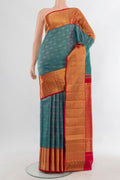 Pure Silk Peacock Blue Kanchipuram Saree with Zari Brocade on the body and Zari Border.  displayed on a mannequin