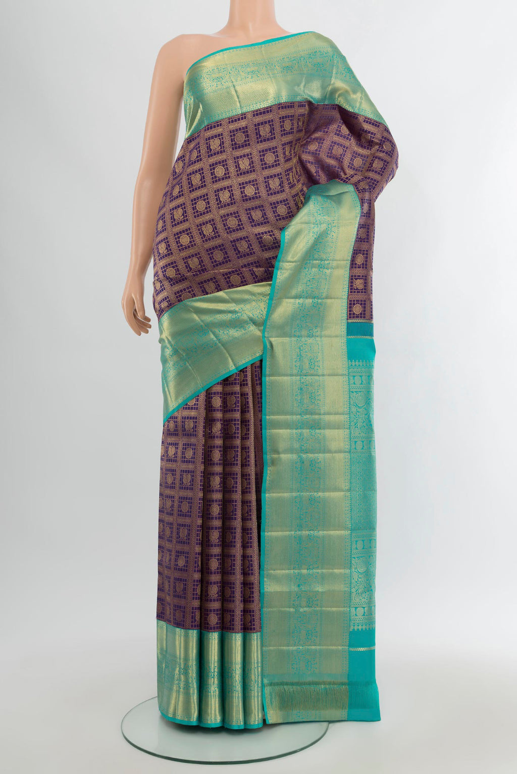 Navy Blue Kanchipuram Silk Saree with Checked design on the body and Zari Border.  displayed on a mannequin