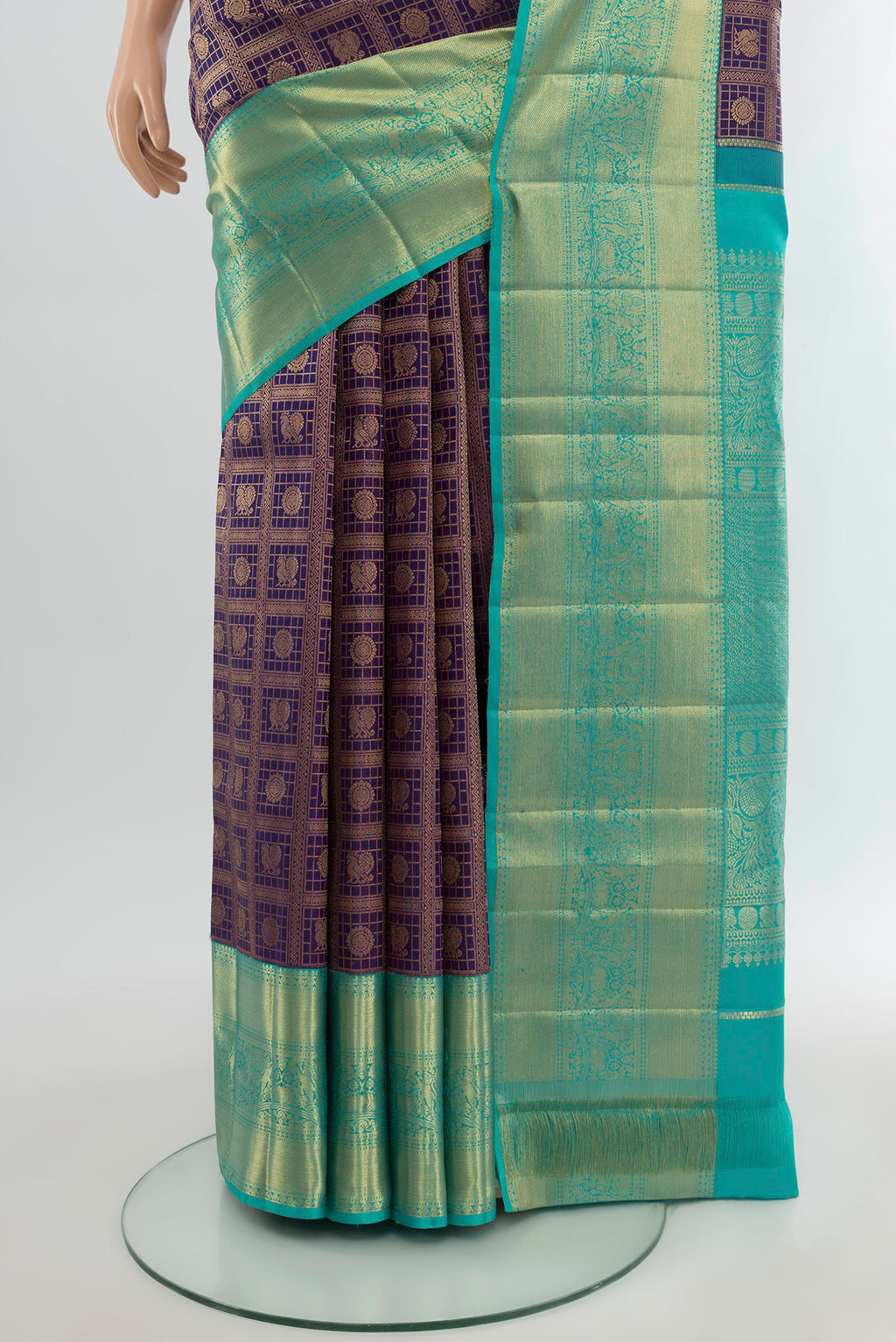 Pleats and pallu of Navy Blue Kanchipuram Silk Saree with Checked design on the body and Zari Border. 