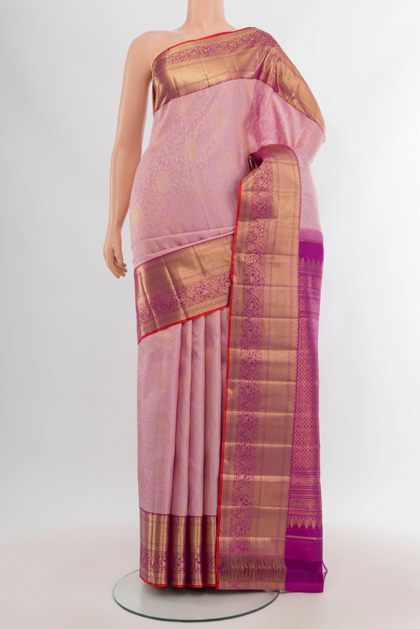 Rose pink Kanchipuram Silk Saree with Zari Brocade on the body and Zari Border.  displayed on a mannequin