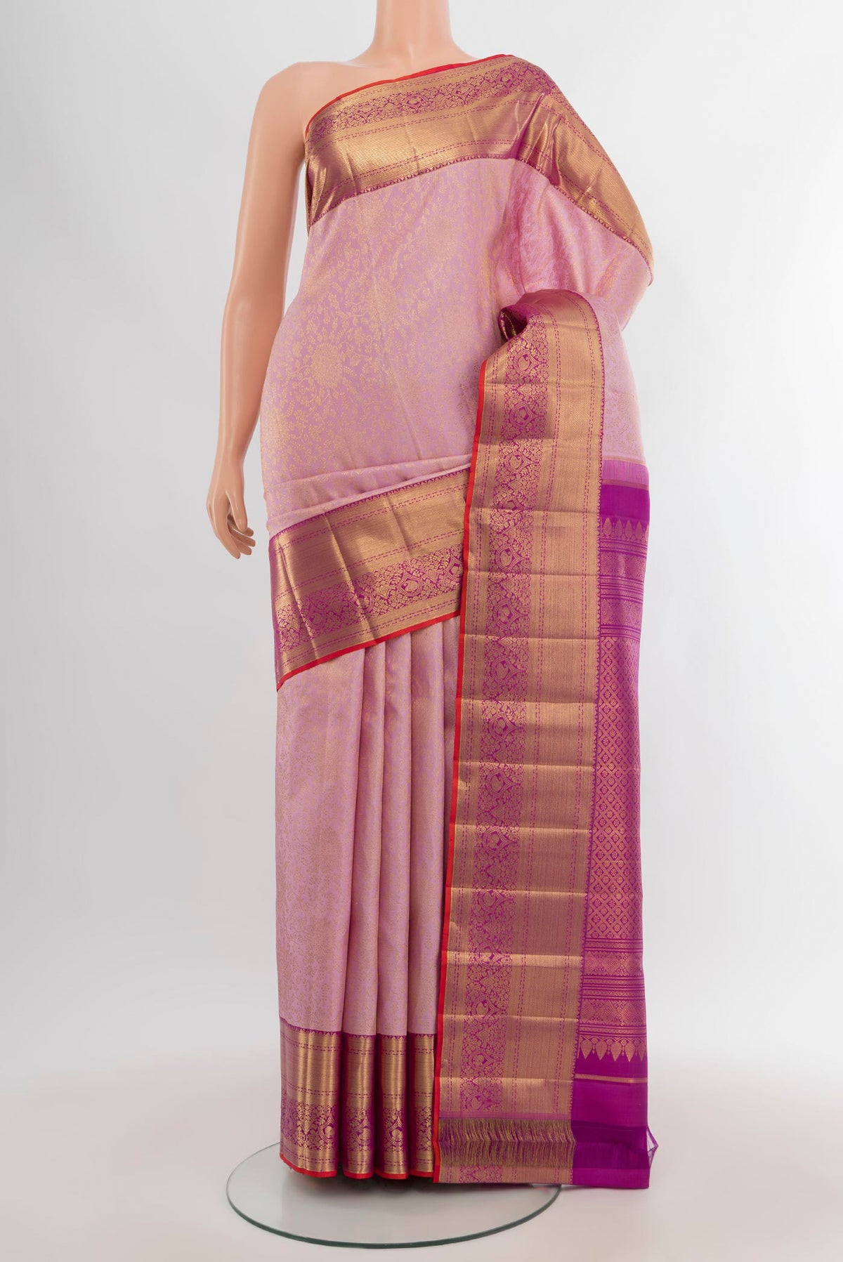 Rose pink Kanchipuram Silk Saree with Zari Brocade on the body and Zari Border.  displayed on a mannequin