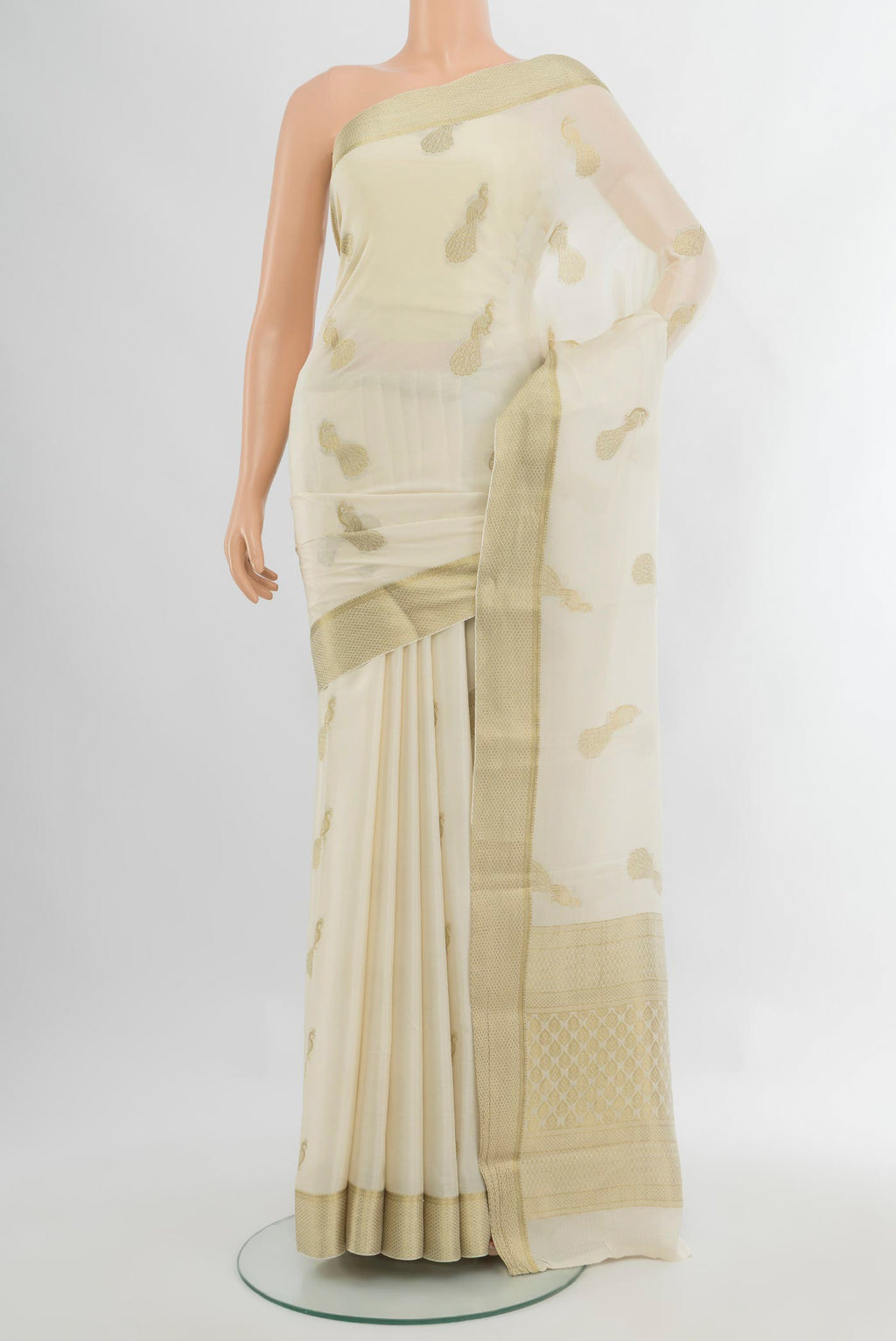Cream Mysore Crepe Saree with Zari Butta on the body and Zari Border.  displayed on a mannequin