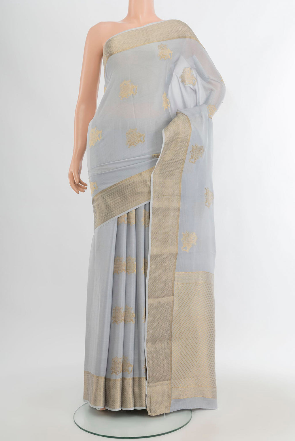 Grey Mysore Crepe Saree with Zari Butta on the body and Zari Border.  displayed on a mannequin