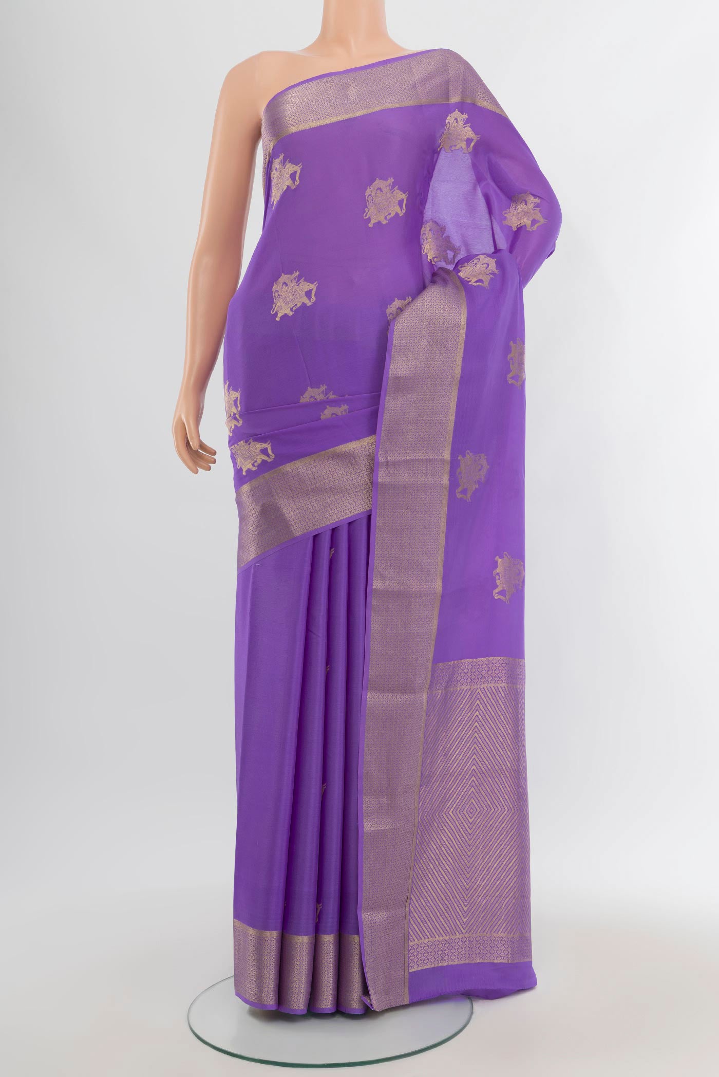 Lavender Mysore Crepe Saree with Zari Butta on the body and Zari Border.  displayed on a mannequin