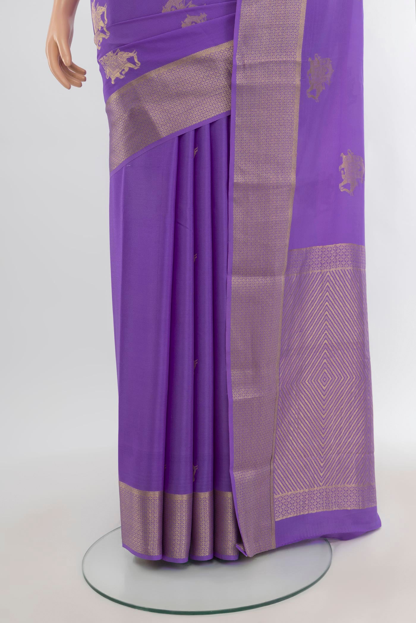 Pleats and pallu of Lavender Mysore Crepe Saree with Zari Butta on the body and Zari Border. 