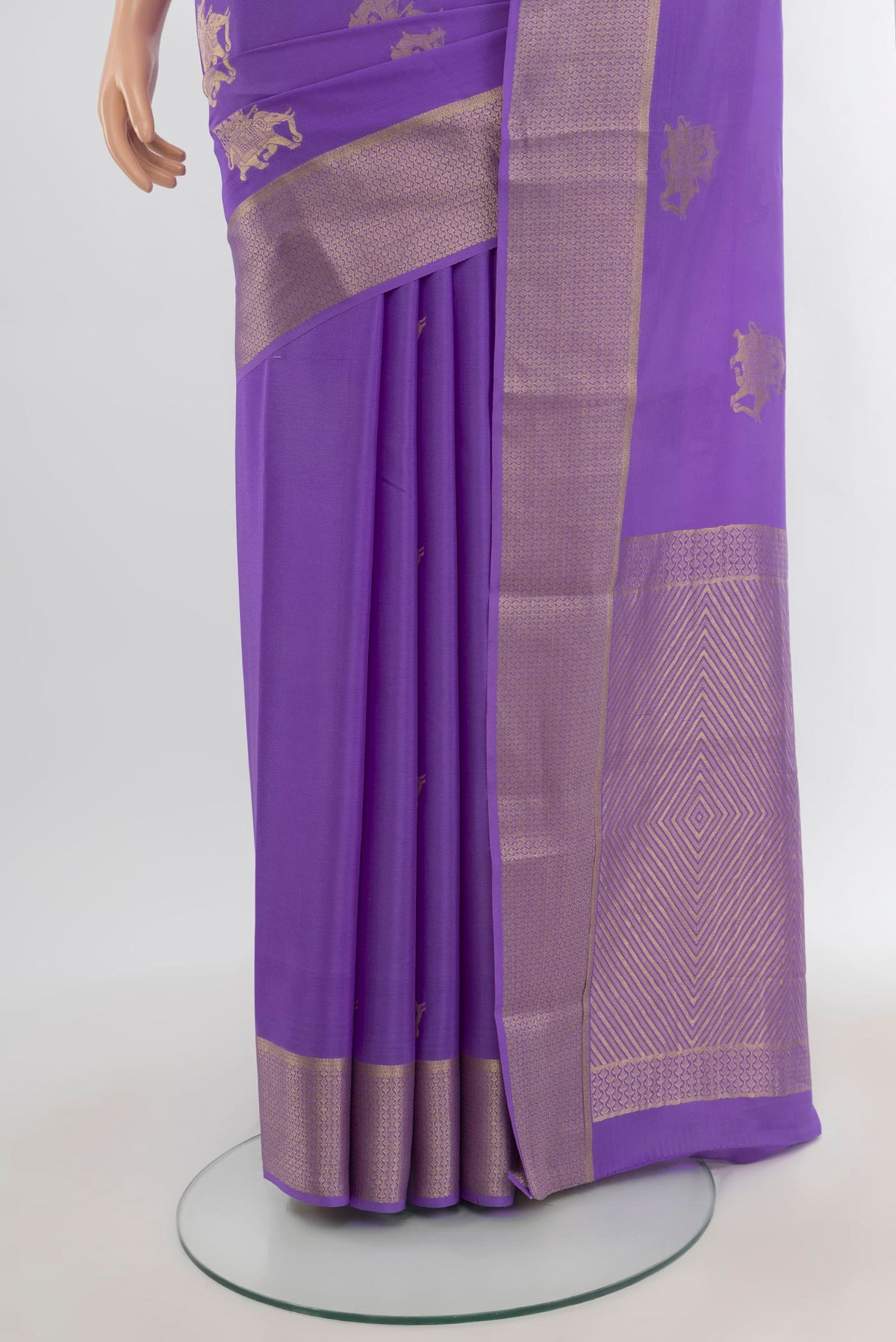 Pleats and pallu of Lavender Mysore Crepe Saree with Zari Butta on the body and Zari Border. 
