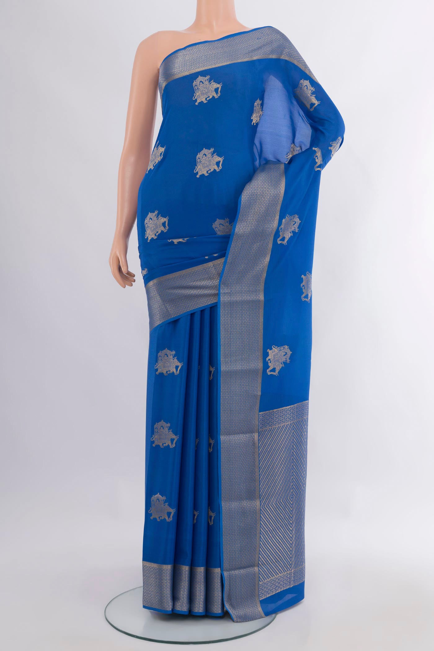 Royal Blue Mysore Crepe Saree with Zari Butta on the body and Zari Border.  displayed on a mannequin