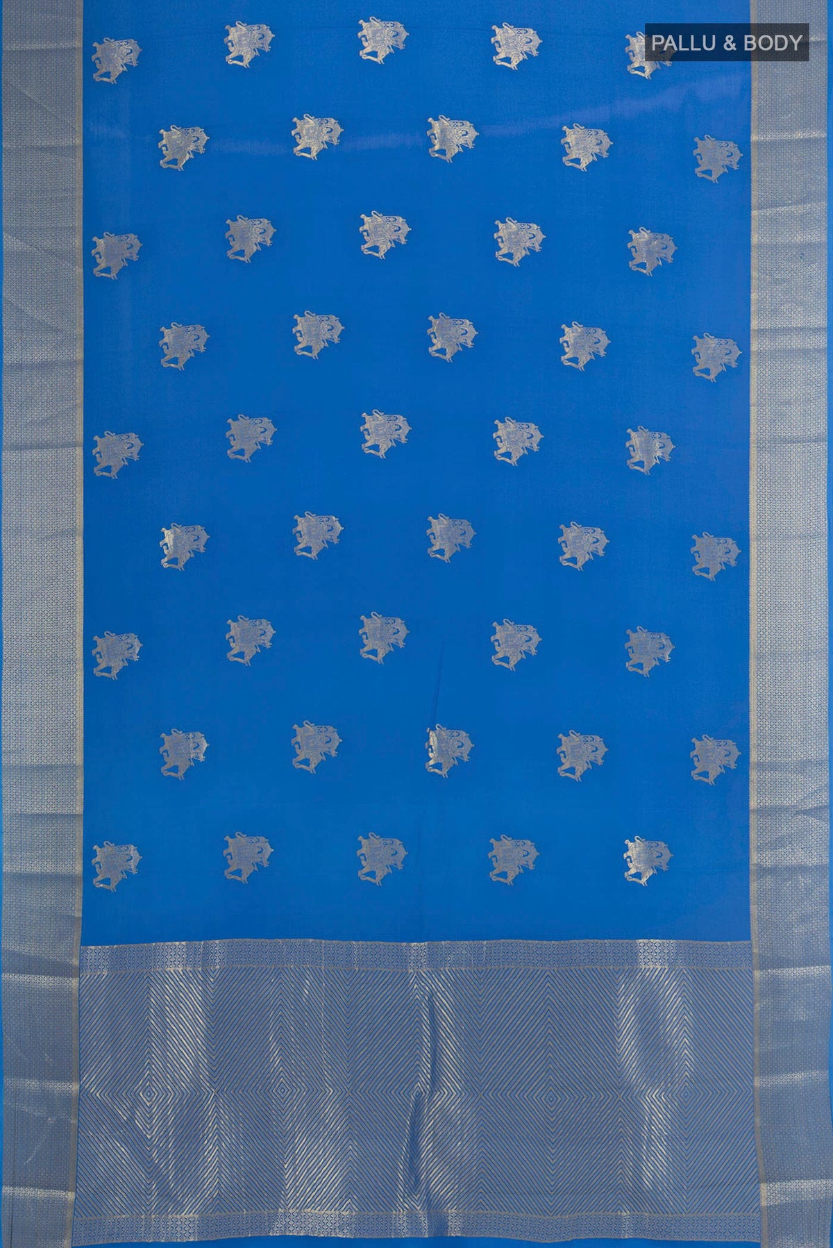 Flat view of Royal Blue Mysore Crepe Saree with Zari Butta on the body and Zari Border. 