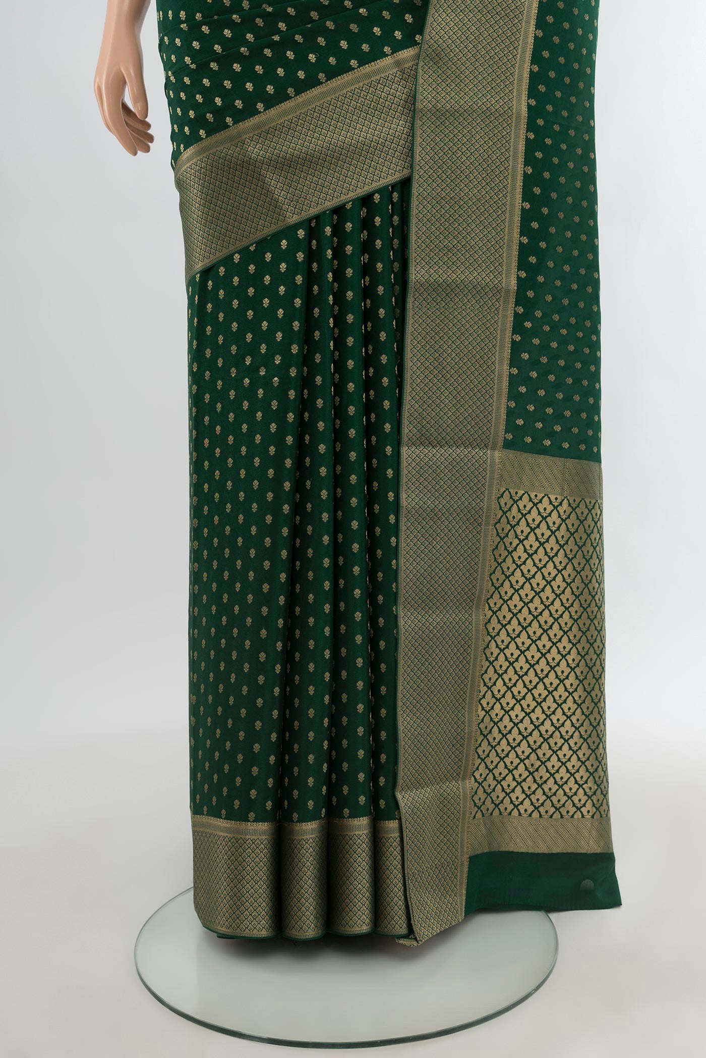 Pleats and pallu of Bottle Green Mysore Crepe Saree with Zari Butta on the body and Zari Border. 