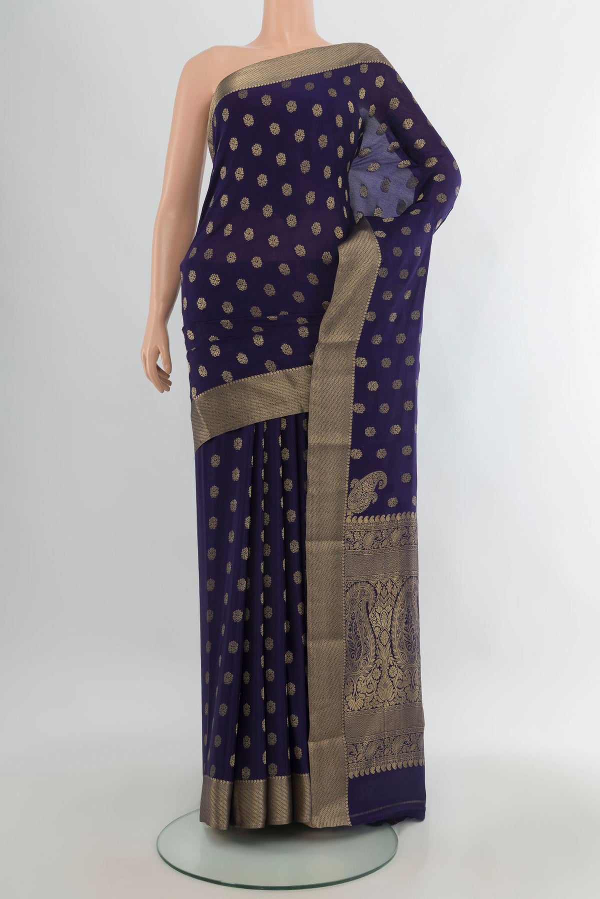 Navy Blue Mysore Crepe Saree with Zari Butta on the body and Zari Border.  displayed on a mannequin