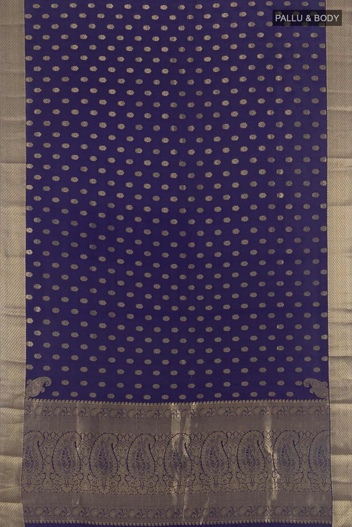 Flat view of Navy Blue Mysore Crepe Saree with Zari Butta on the body and Zari Border. 