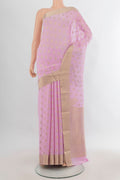 Rose pink Mysore Crepe Saree with Zari Butta on the body and Zari Border.  displayed on a mannequin