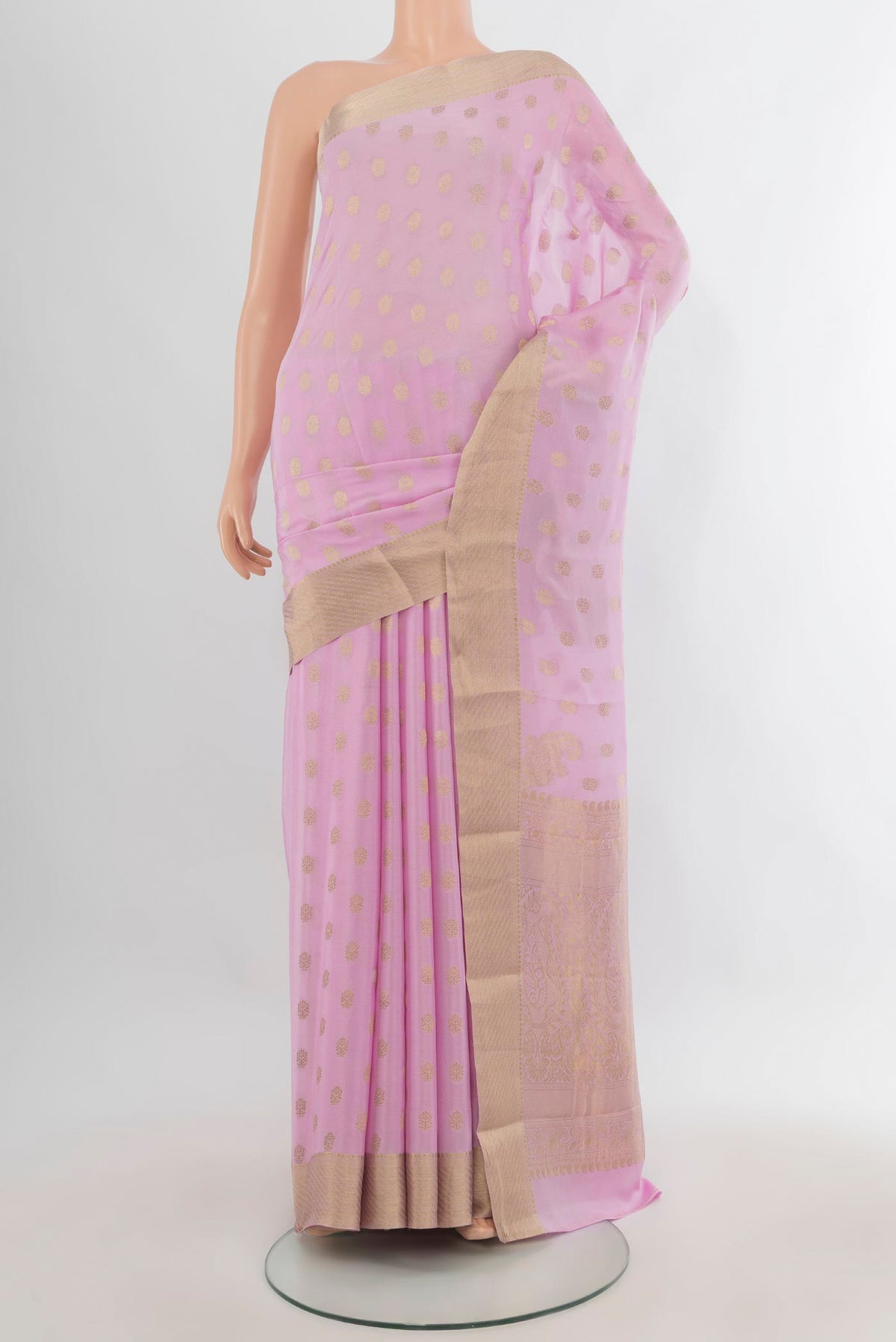 Rose pink Mysore Crepe Saree with Zari Butta on the body and Zari Border.  displayed on a mannequin