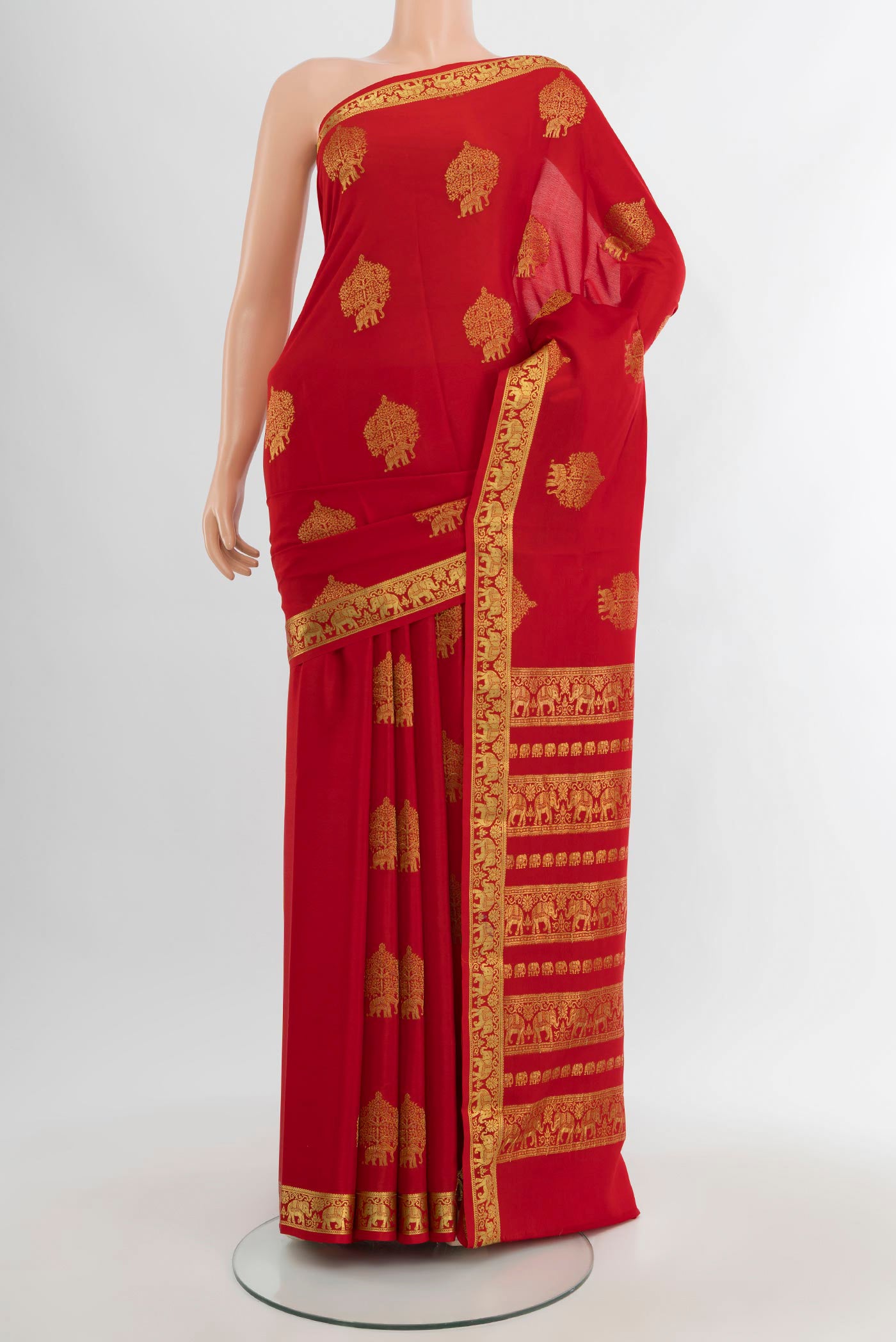 Red Mysore Crepe Saree with Zari Butta on the body and Zari Border.  displayed on a mannequin