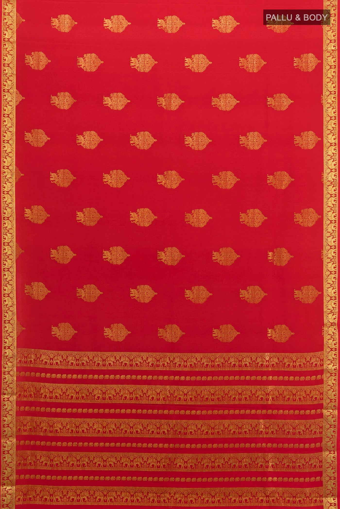 Flat view of Red Mysore Crepe Saree with Zari Butta on the body and Zari Border. 