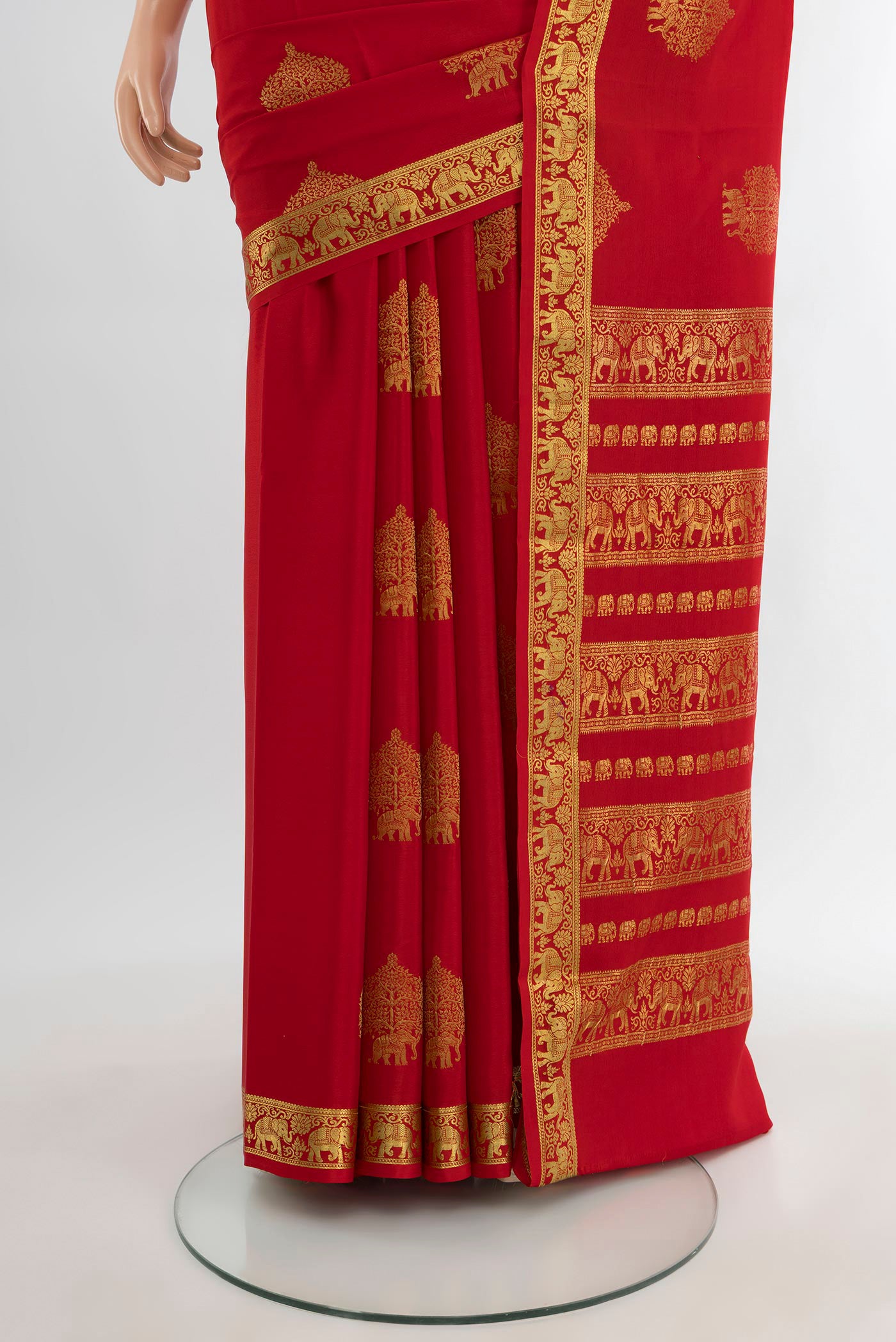 Pleats and pallu of Red Mysore Crepe Saree with Zari Butta on the body and Zari Border. 