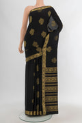 Black Mysore Crepe Saree with Zari Butta on the body and Zari Border.  displayed on a mannequin