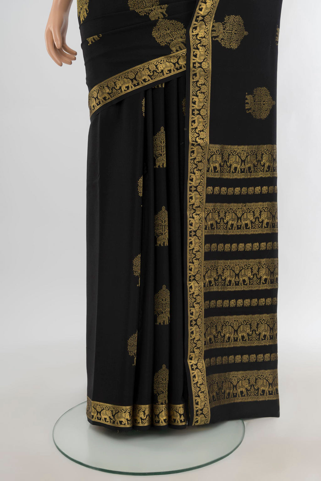 Pleats and pallu of Black Mysore Crepe Saree with Zari Butta on the body and Zari Border. 