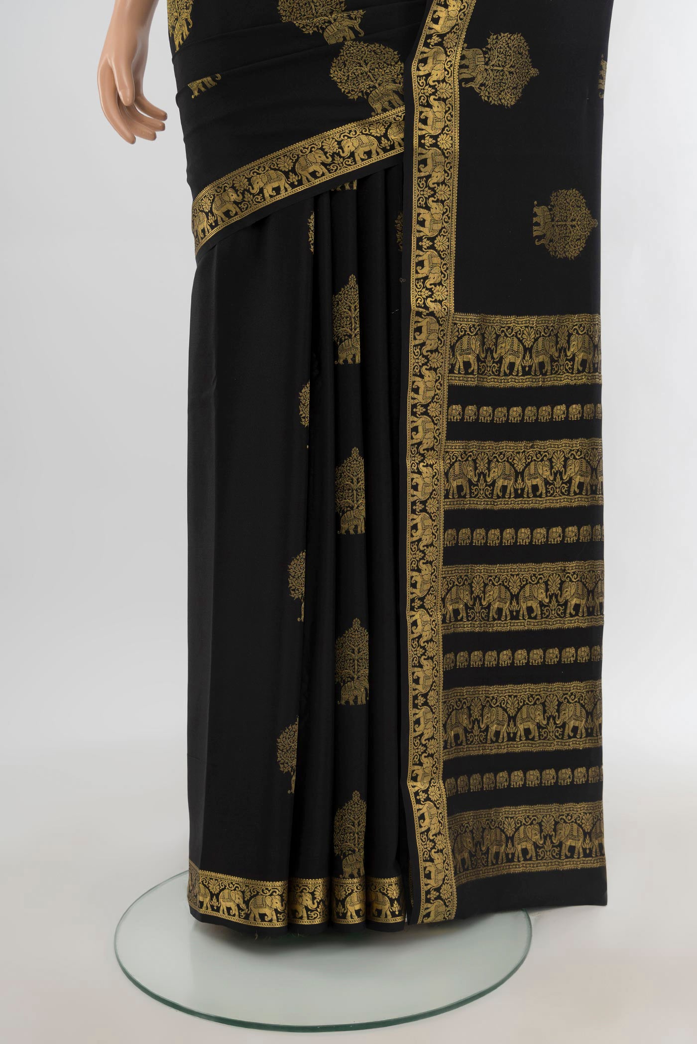 Pleats and pallu of Black Mysore Crepe Saree with Zari Butta on the body and Zari Border. 