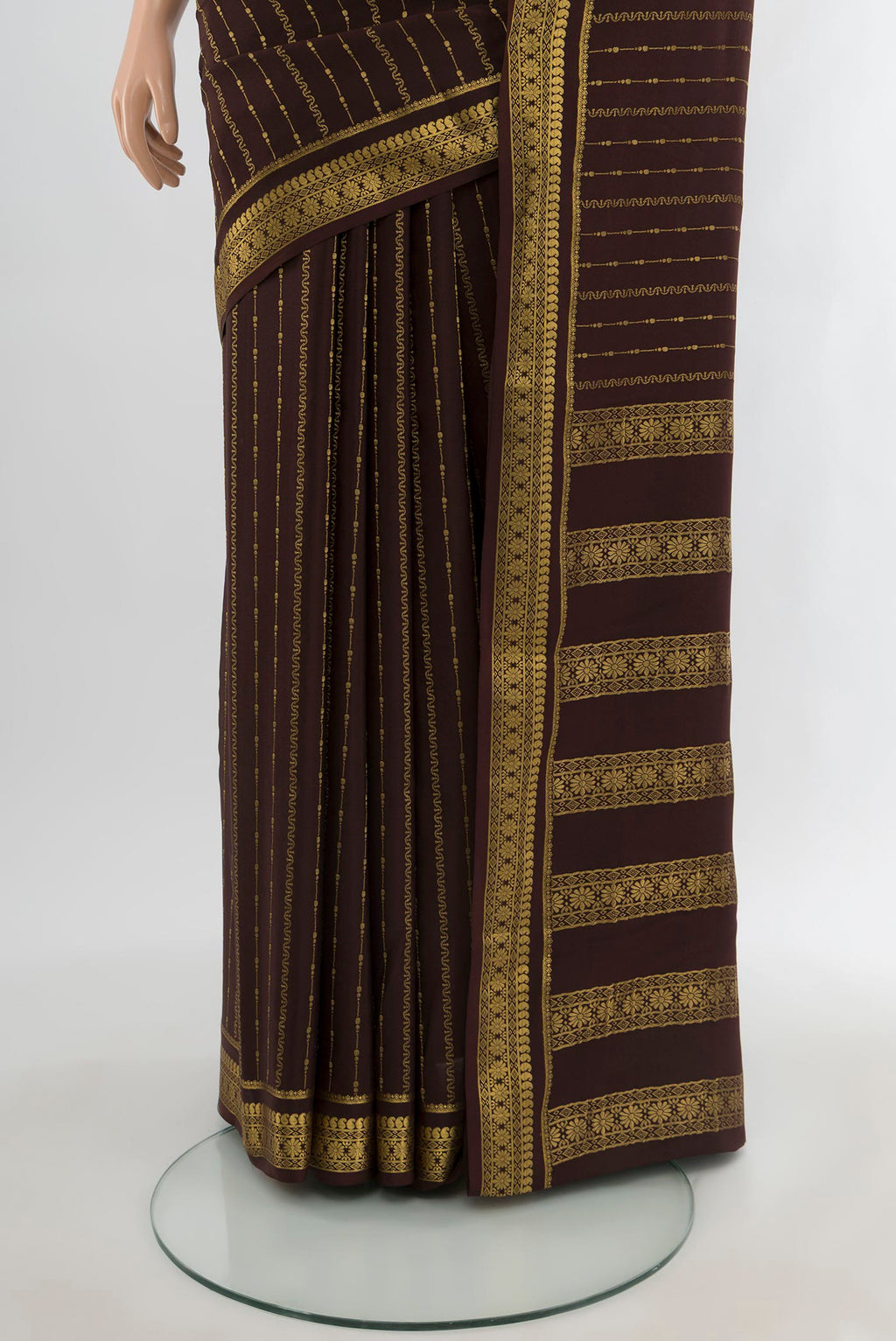 Pleats and pallu of Coffee Brown Mysore Crepe Saree with Stripes on the body and Zari Border. 