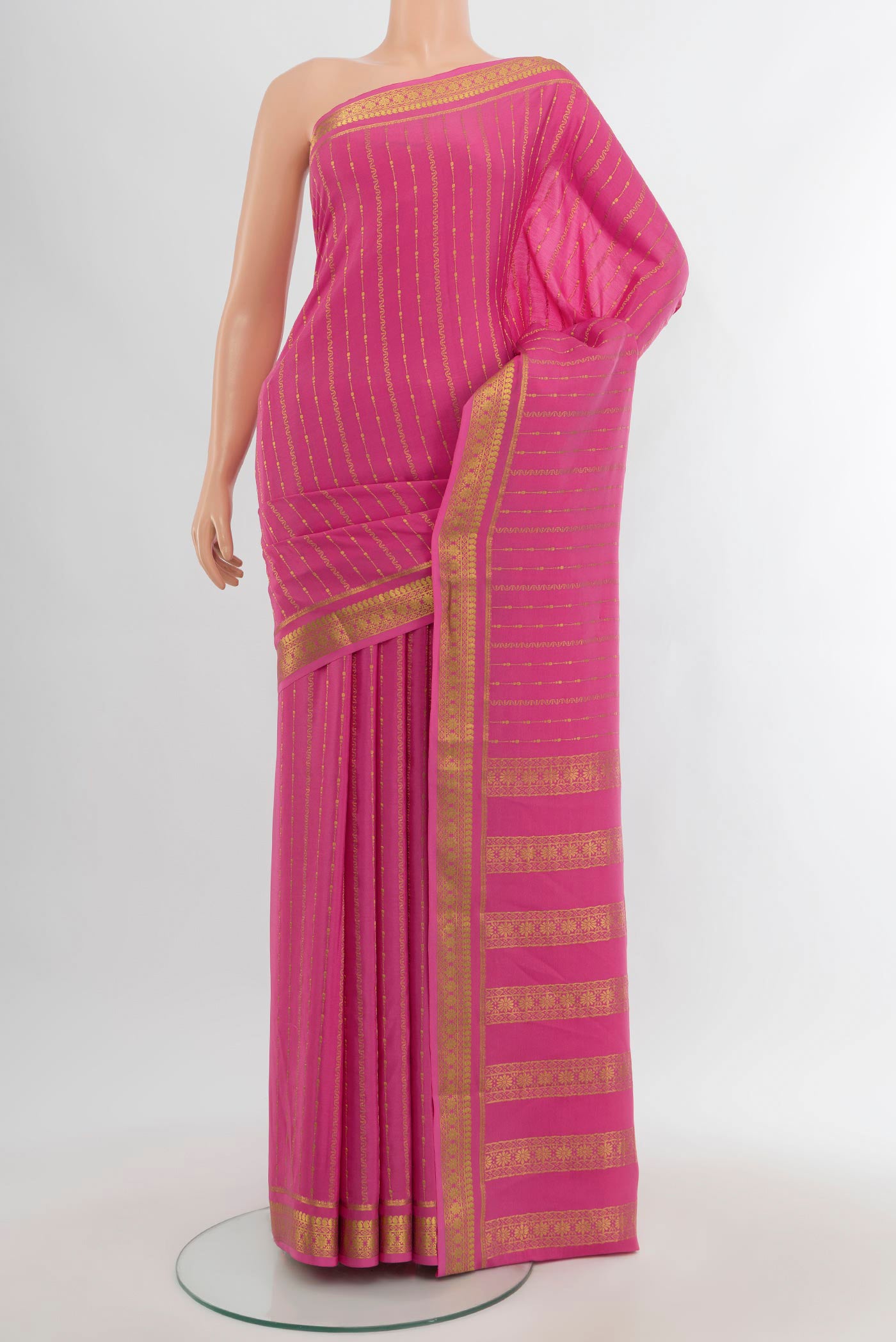 Rose pink Mysore Crepe Saree with Stripes on the body and Zari Border.  displayed on a mannequin