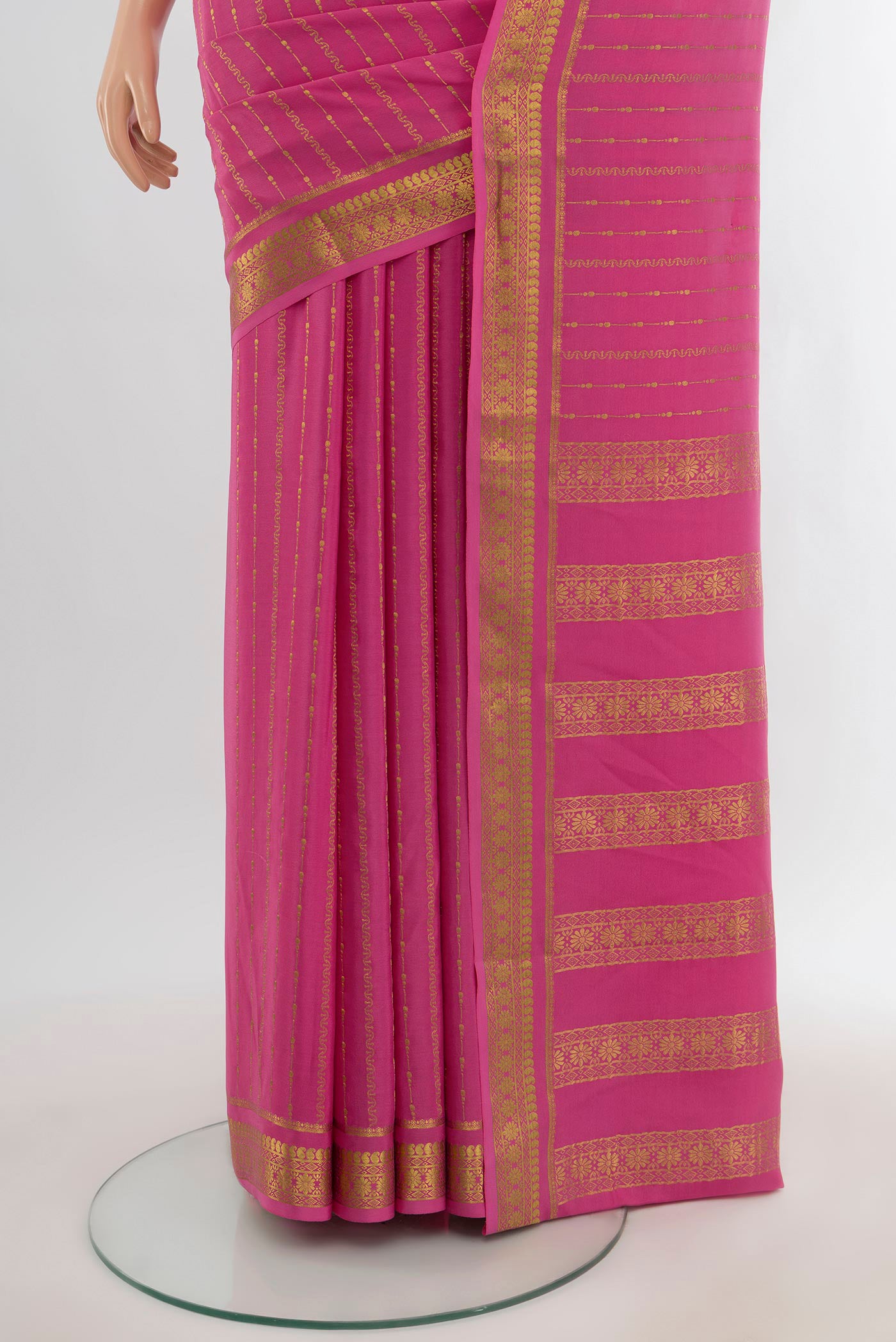 Pleats and pallu of Rose pink Mysore Crepe Saree with Stripes on the body and Zari Border. 