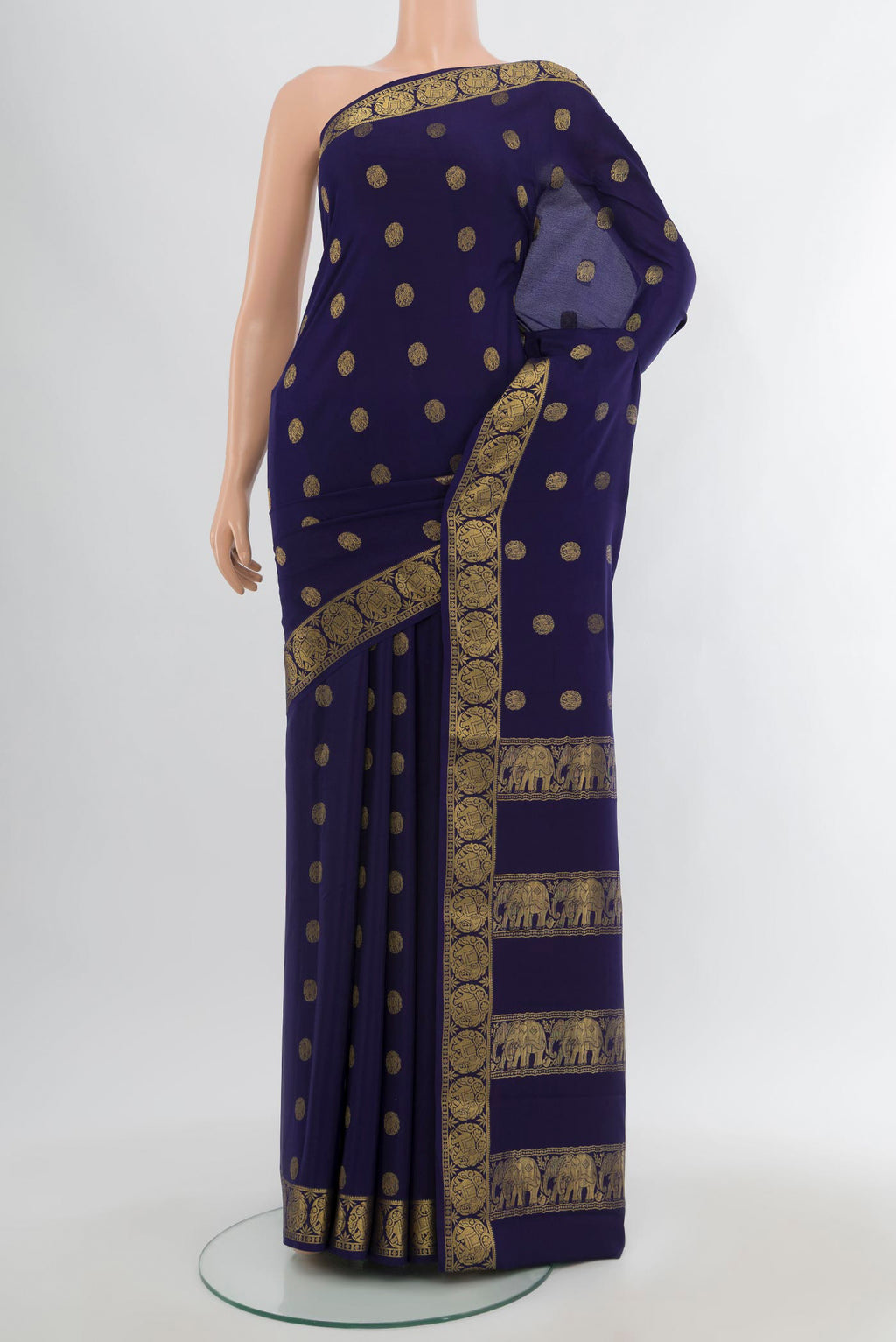 Navy Blue Mysore Crepe Saree with Zari Butta on the body and Zari Border.  displayed on a mannequin