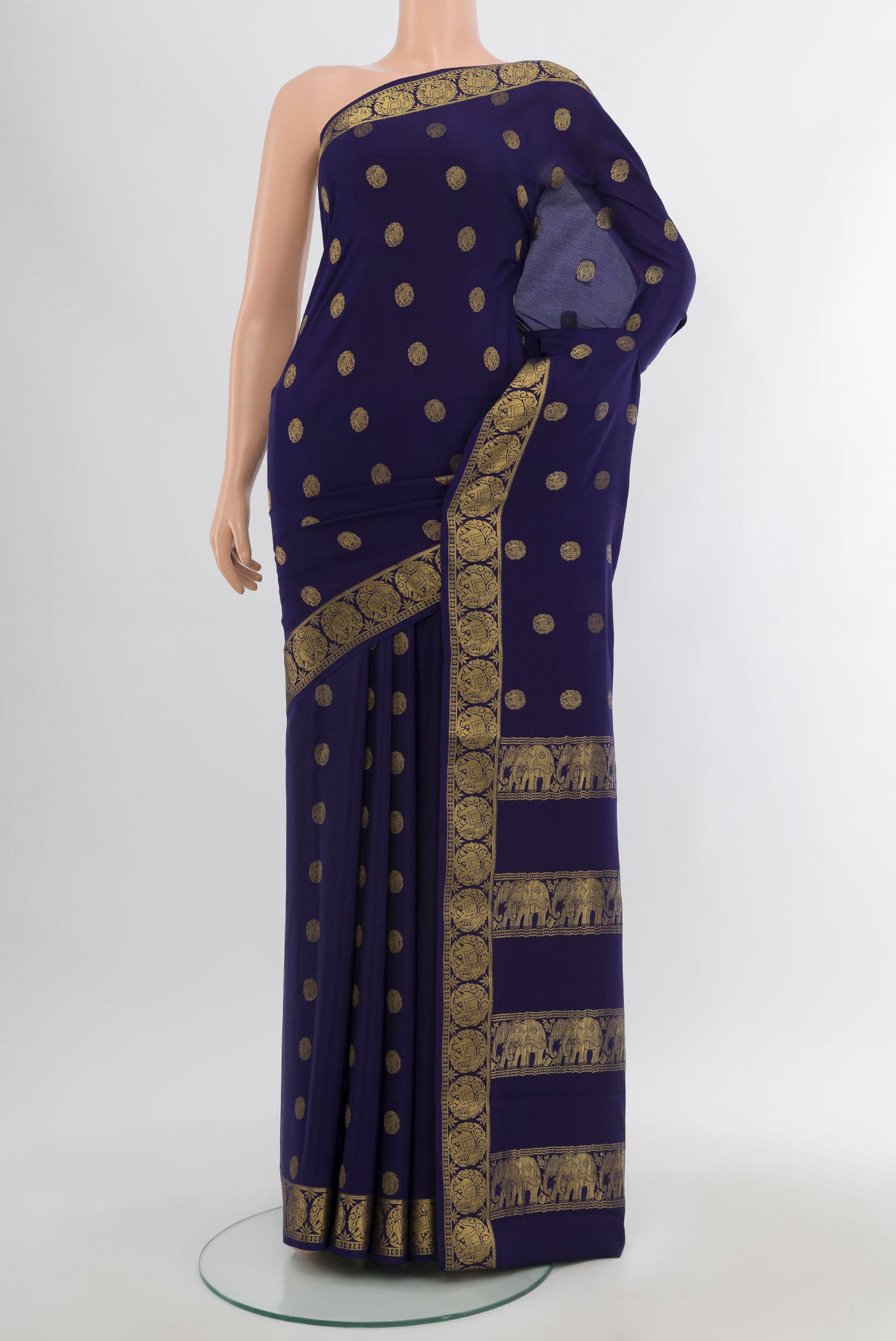 Navy Blue Mysore Crepe Saree with Zari Butta on the body and Zari Border.  displayed on a mannequin