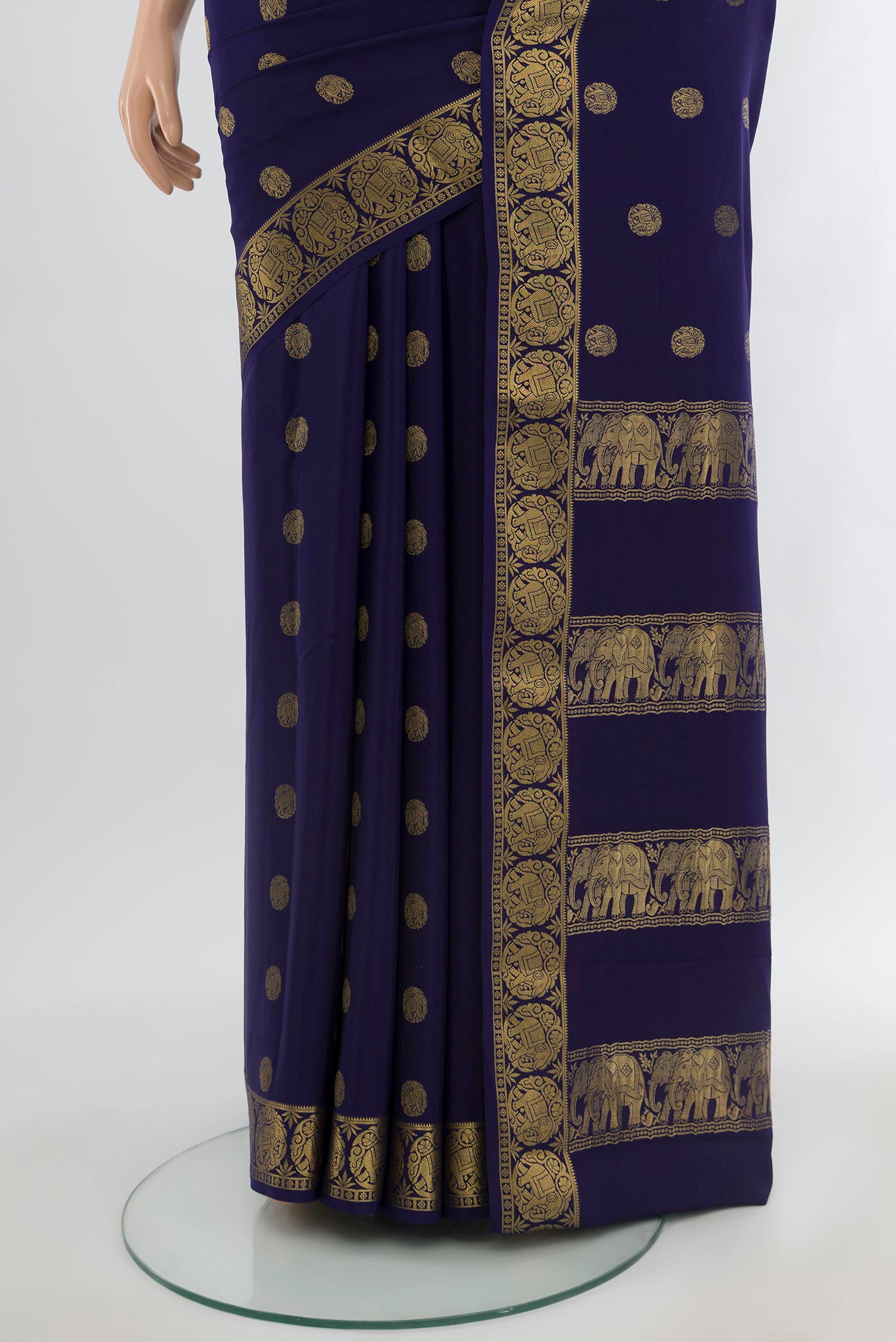 Pleats and pallu of Navy Blue Mysore Crepe Saree with Zari Butta on the body and Zari Border. 