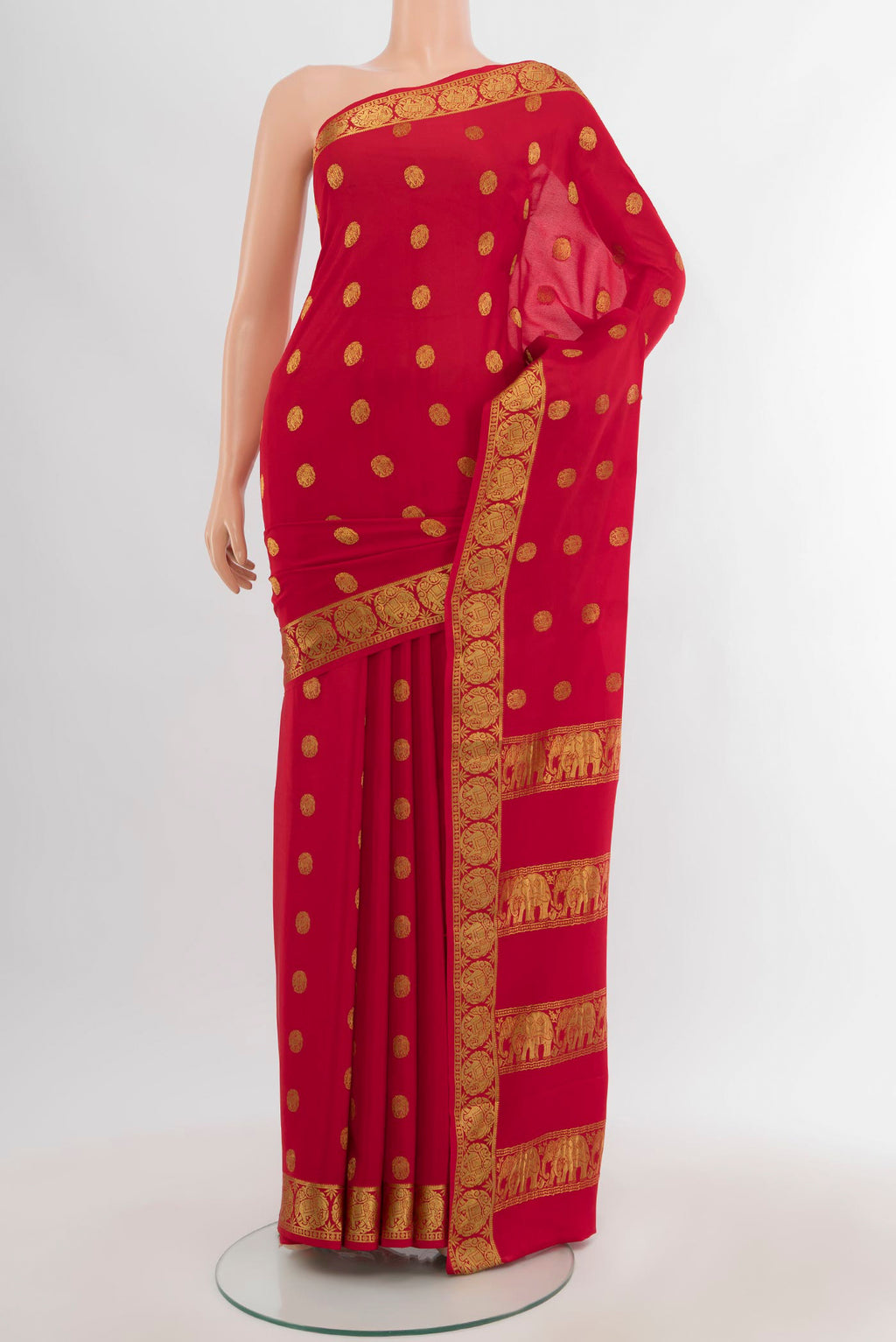 Red Mysore Crepe Saree with Zari Butta on the body and Zari Border.  displayed on a mannequin