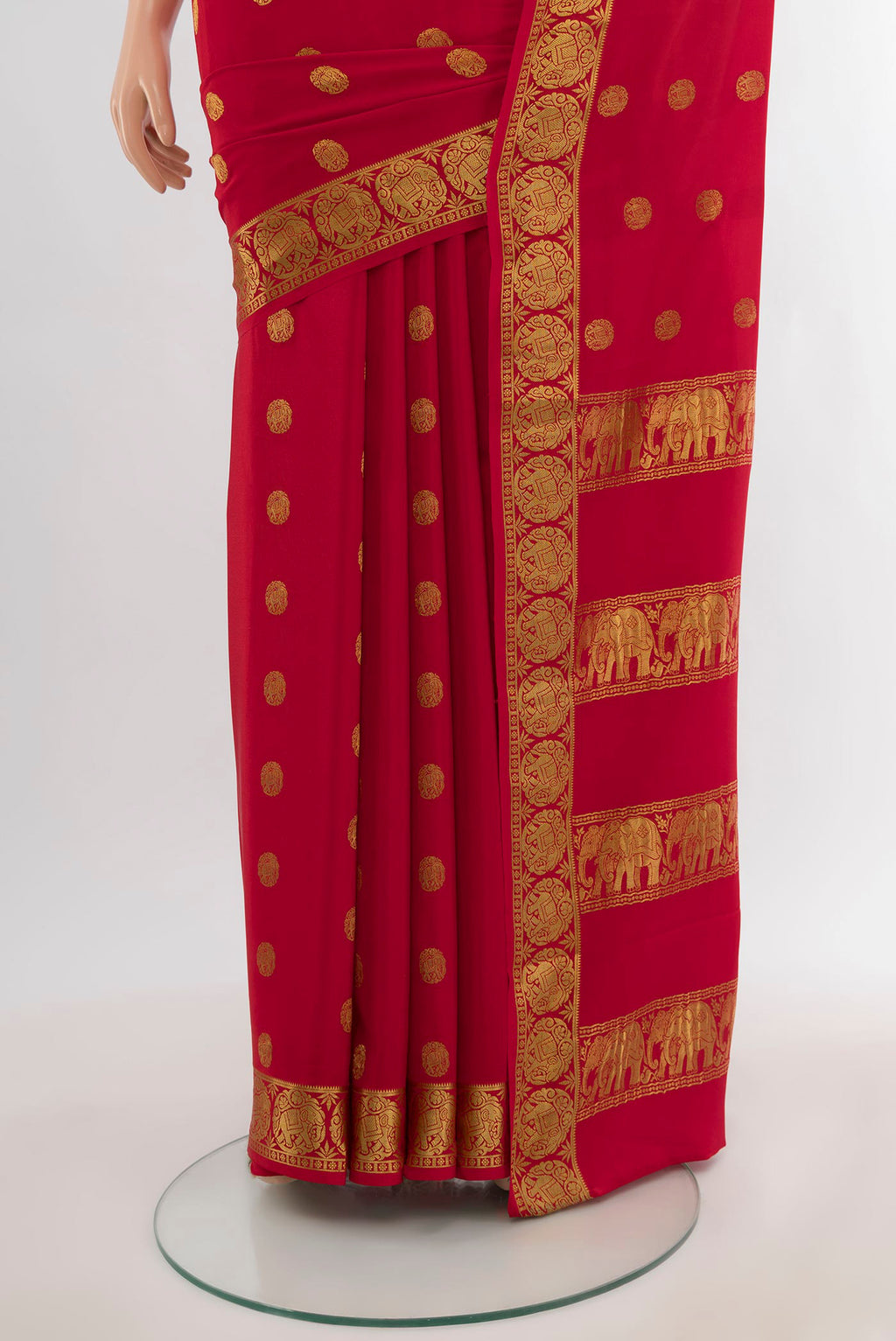 Pleats and pallu of Red Mysore Crepe Saree with Zari Butta on the body and Zari Border. 