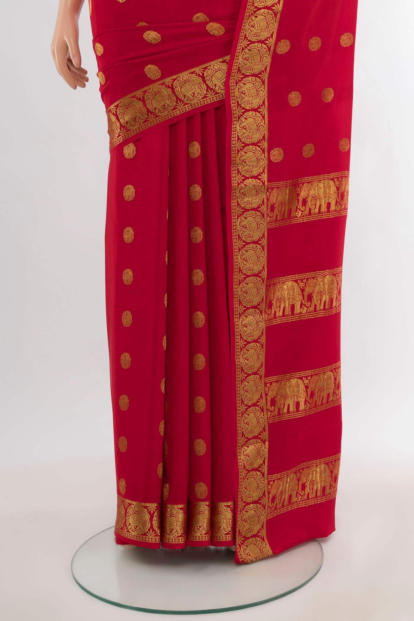 Pleats and pallu of Red Mysore Crepe Saree with Zari Butta on the body and Zari Border. 